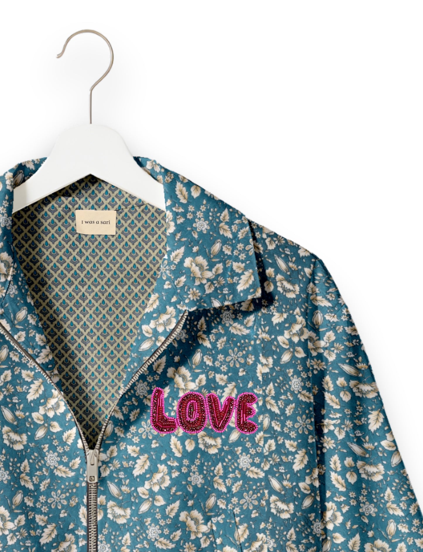 Love Bomber Jacket made from recycled fabric, featuring hand-stitched Aari embroidery. A unique piece of zero-waste clothing, part of the circular fashion movement. Designed with upcycled materials for a stylish yet environmentally friendly clothing choice.