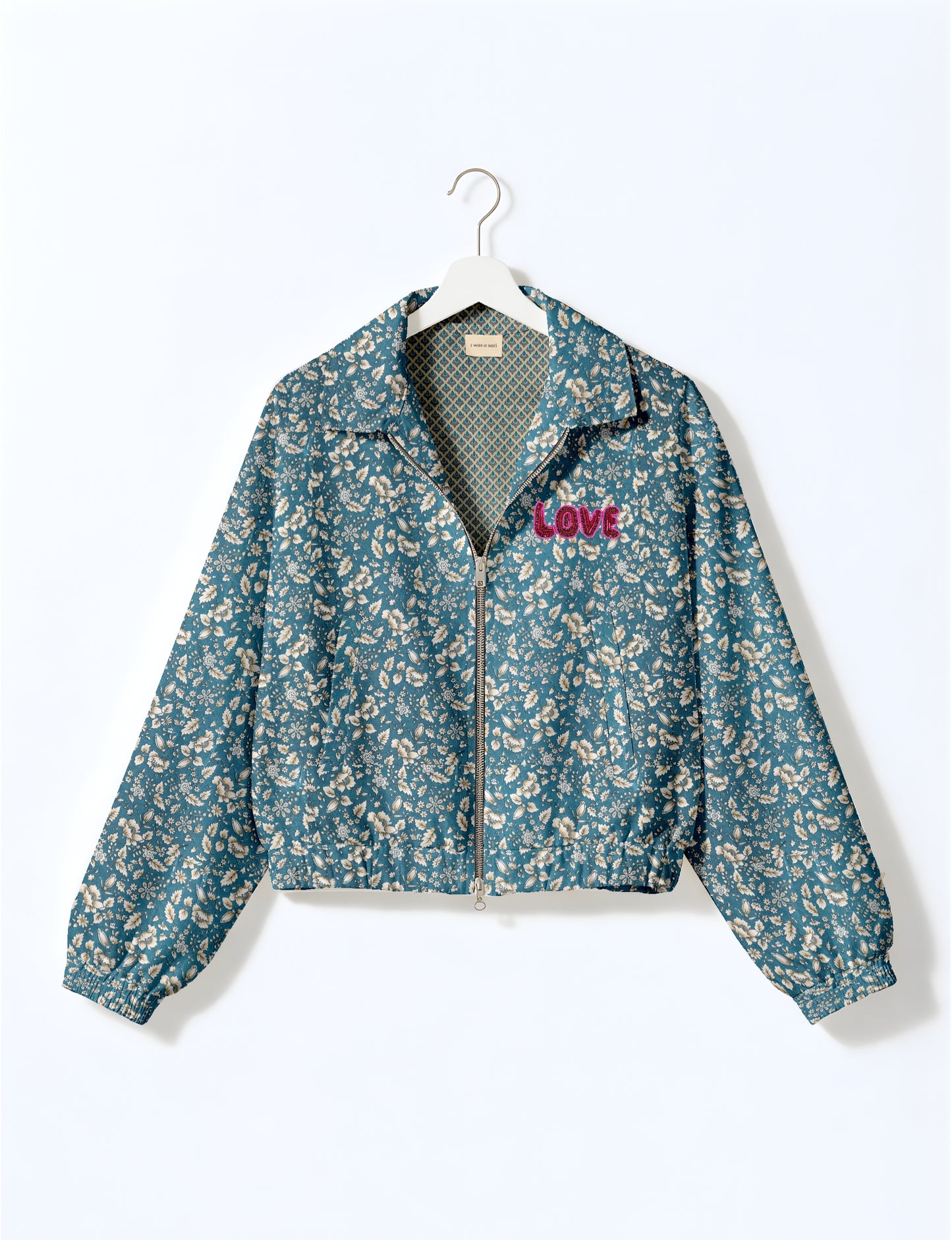 Love Bomber Jacket made from recycled fabric, featuring hand-stitched Aari embroidery. A unique piece of zero-waste clothing, part of the circular fashion movement. Designed with upcycled materials for a stylish yet environmentally friendly clothing choice.