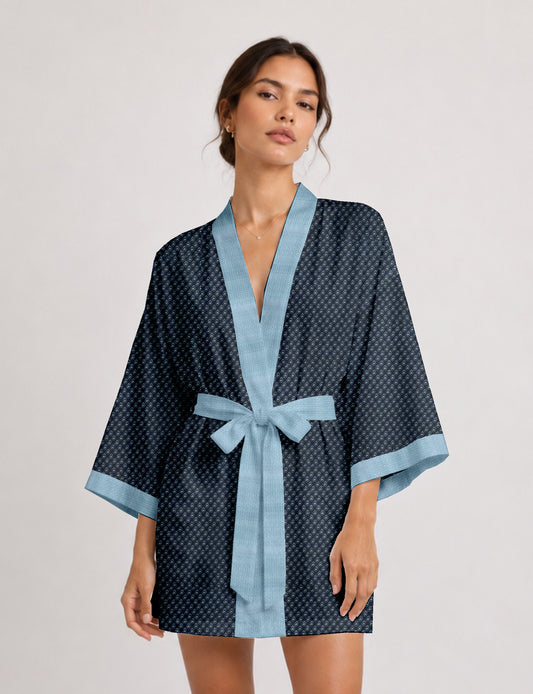 Short kimono robe with wrap front, V-neckline, wide sleeves, waist tie, and concealed skort detail.