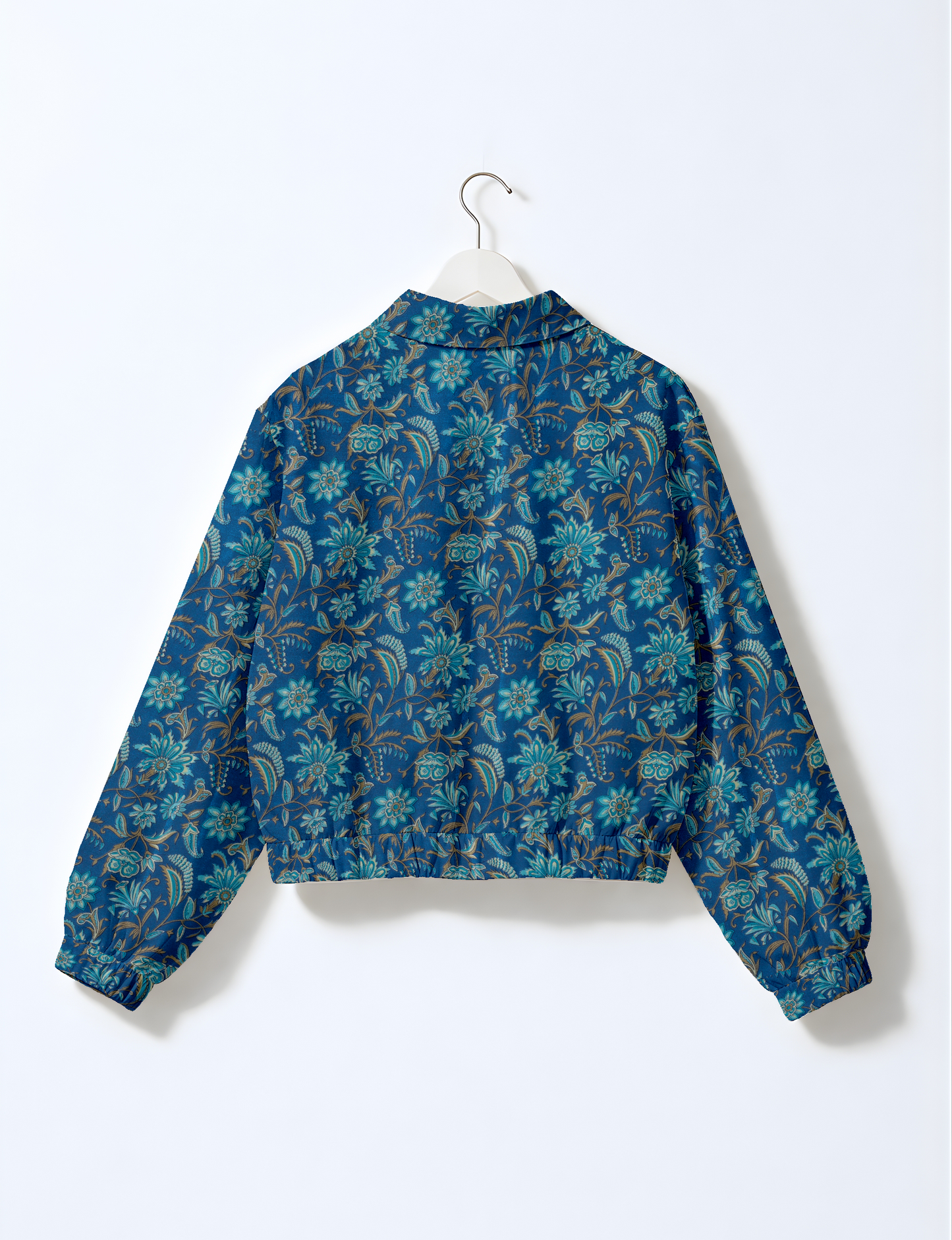 Upcycled Bomber Jacket made from recycled sari materials, featuring a cute cropped shape, elasticated hem and cuffs, and contrast sari print lining. Sustainable apparel promoting eco-friendly fashion and ethical clothing.