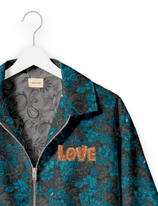 Love Bomber Jacket made from recycled fabric, featuring hand-stitched Aari embroidery. A unique piece of zero-waste clothing, part of the circular fashion movement. Designed with upcycled materials for a stylish yet environmentally friendly clothing choice.
