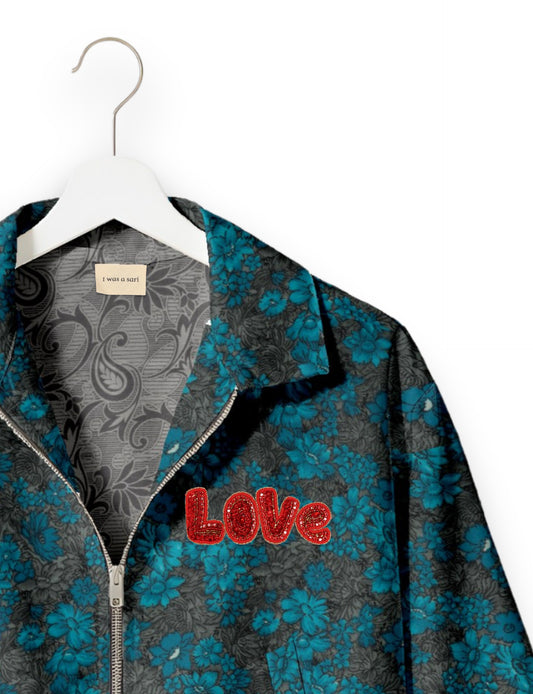 Love Bomber Jacket made from recycled fabric, featuring hand-stitched Aari embroidery. A unique piece of zero-waste clothing, part of the circular fashion movement. Designed with upcycled materials for a stylish yet environmentally friendly clothing choice.