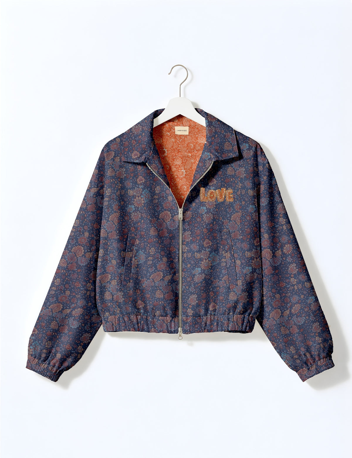 Love Bomber Jacket made from recycled fabric, featuring hand-stitched Aari embroidery. A unique piece of zero-waste clothing, part of the circular fashion movement. Designed with upcycled materials for a stylish yet environmentally friendly clothing choice.