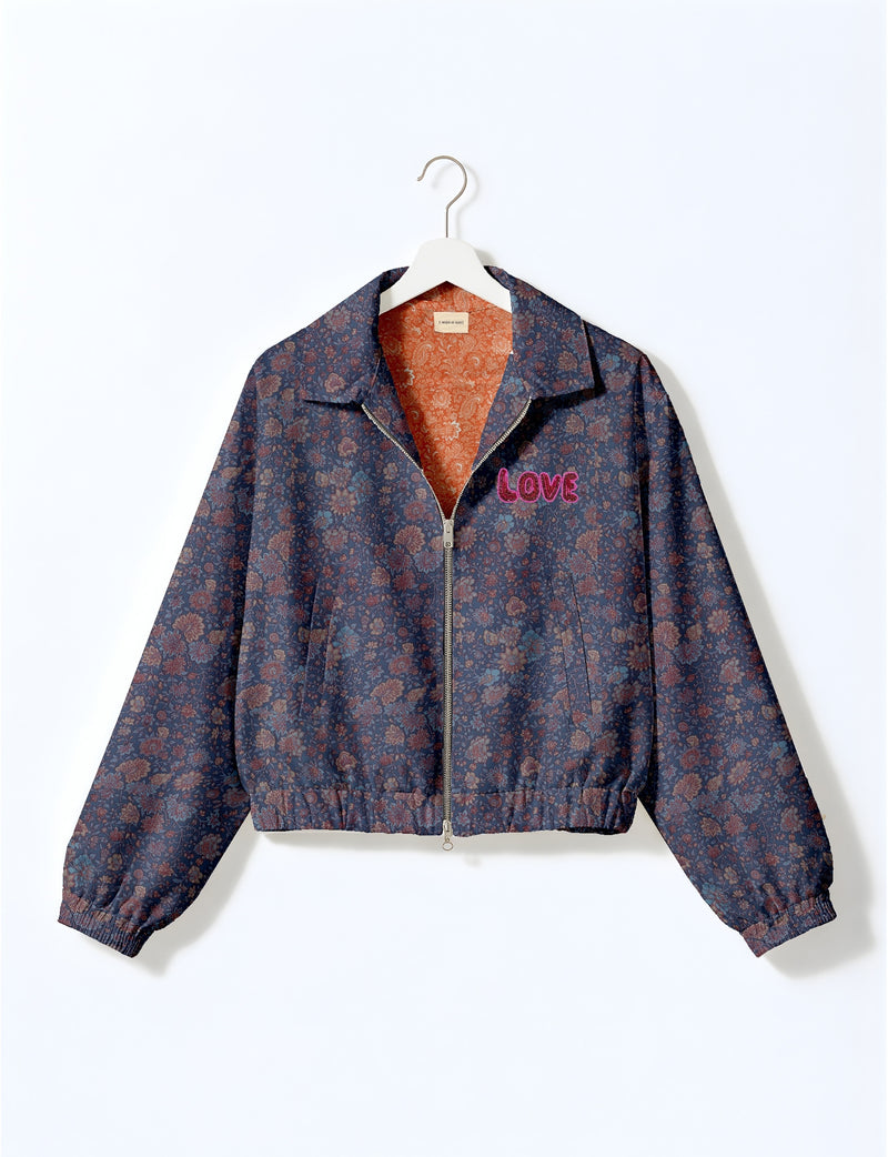 Love Bomber Jacket made from recycled fabric, featuring hand-stitched Aari embroidery. A unique piece of zero-waste clothing, part of the circular fashion movement. Designed with upcycled materials for a stylish yet environmentally friendly clothing choice.