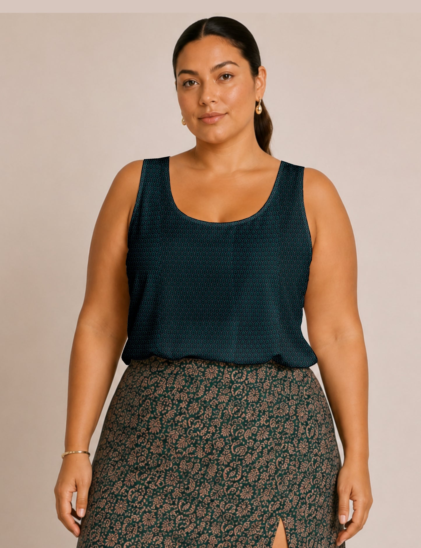 Women's sleeveless blouse with a relaxed straight fit, wide scoop neckline, deep scoop back, and hip-length silhouette.
