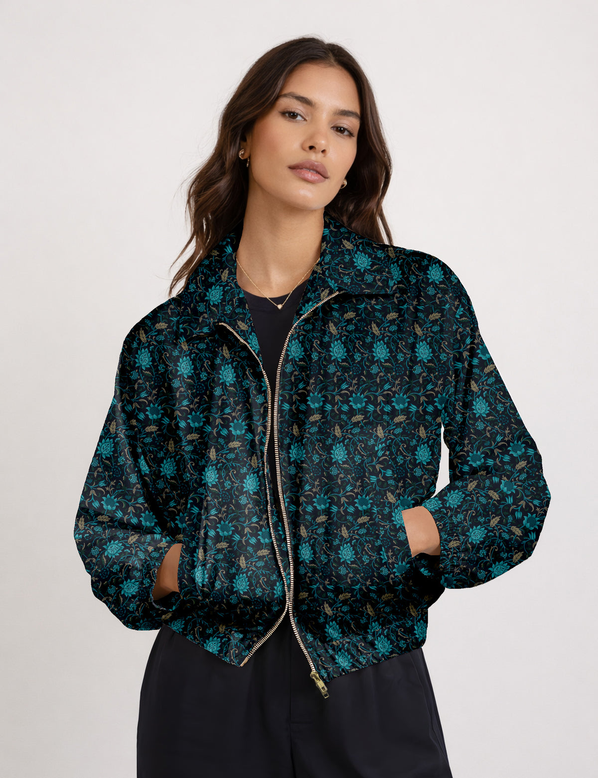Brown floral bomber jacket with front zipper, elastic cuffs and hem, hanging on white hanger, red floral inner lining visible
