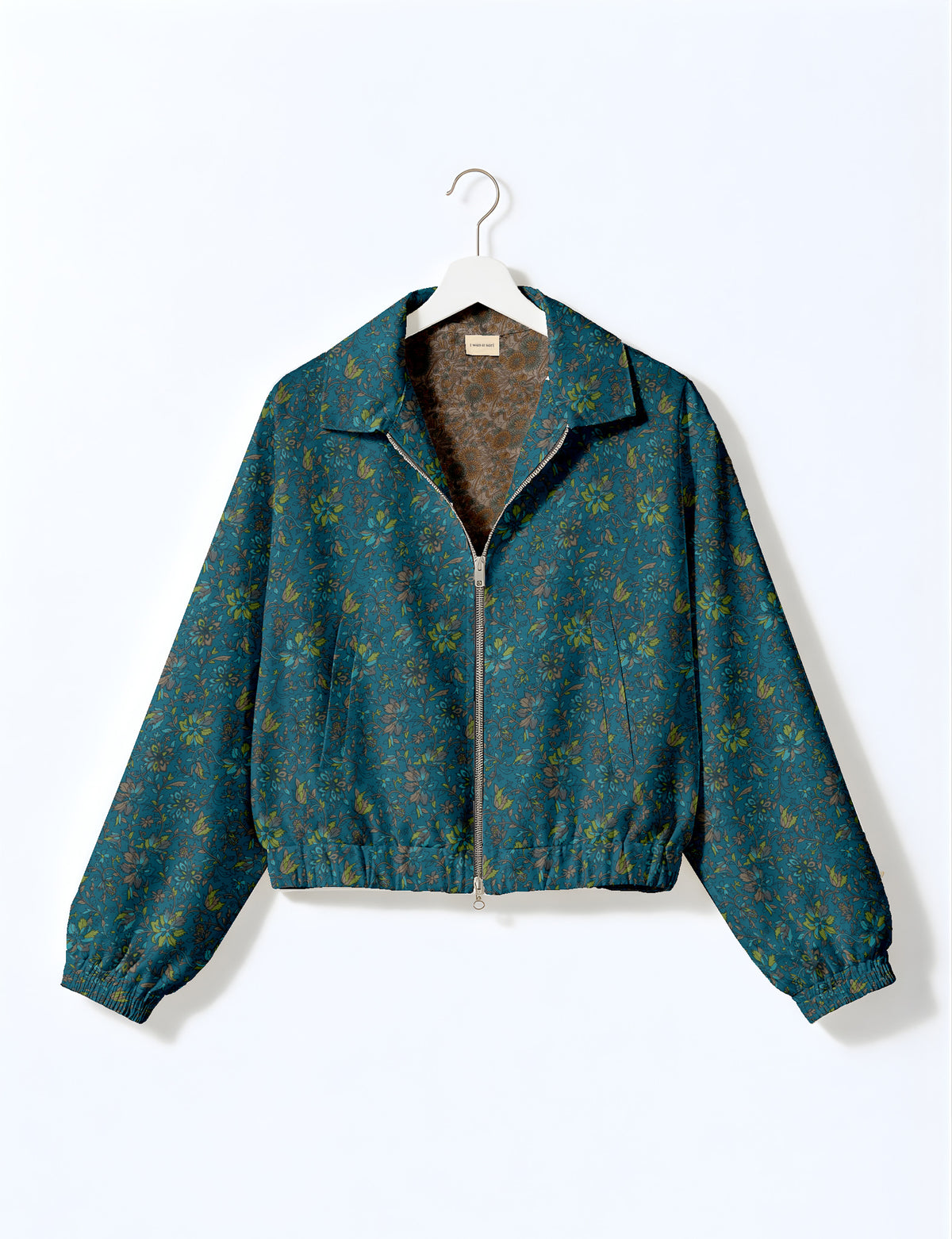 Woman wearing a yellow floral bomber jacket with front zipper, elastic cuffs, and side pockets, shown from front view