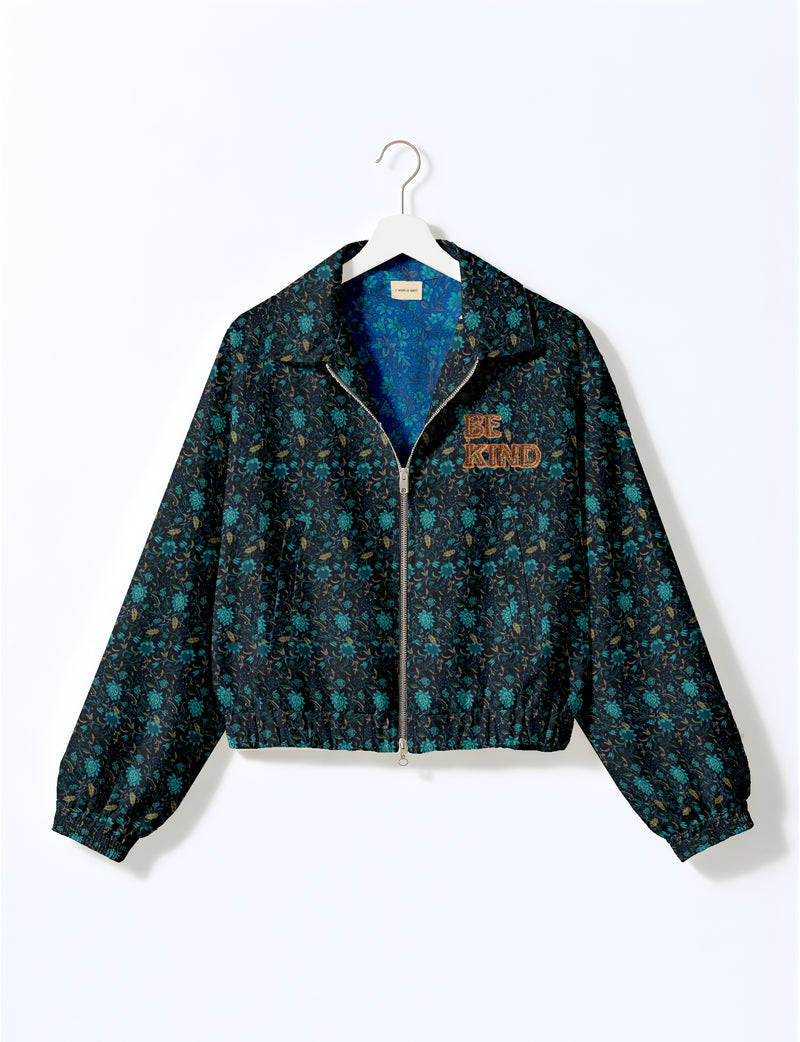 BE KIND Bomber jacket made from upcycled sari fabric with handcrafted Aari embroidery by female artisans.