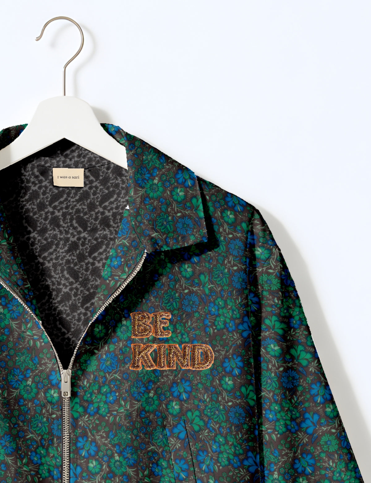 BE KIND Bomber jacket made from upcycled sari fabric with handcrafted Aari embroidery by female artisans.