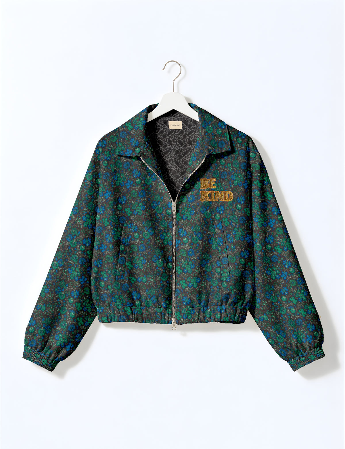 BE KIND Bomber jacket made from upcycled sari fabric with handcrafted Aari embroidery by female artisans.