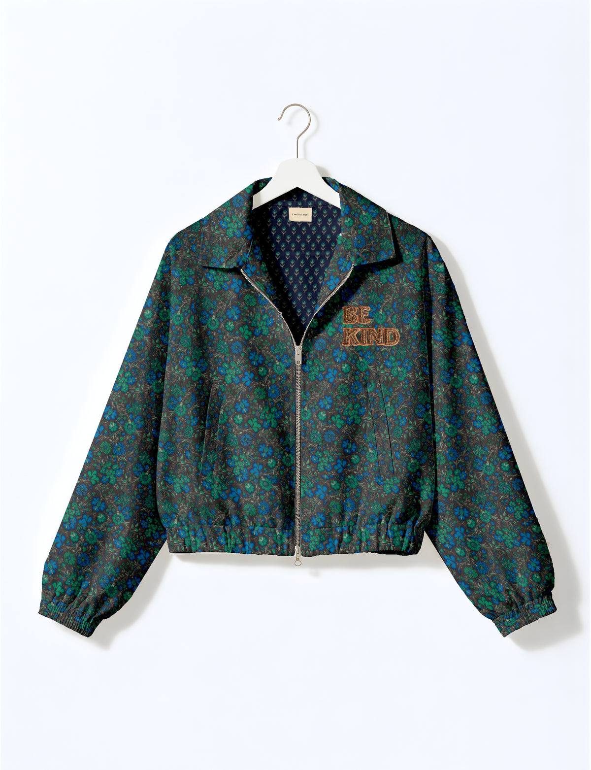 BE KIND Bomber jacket made from upcycled sari fabric with handcrafted Aari embroidery by female artisans.