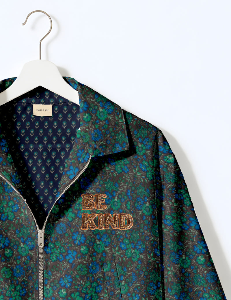 BE KIND Bomber jacket made from upcycled sari fabric with handcrafted Aari embroidery by female artisans.