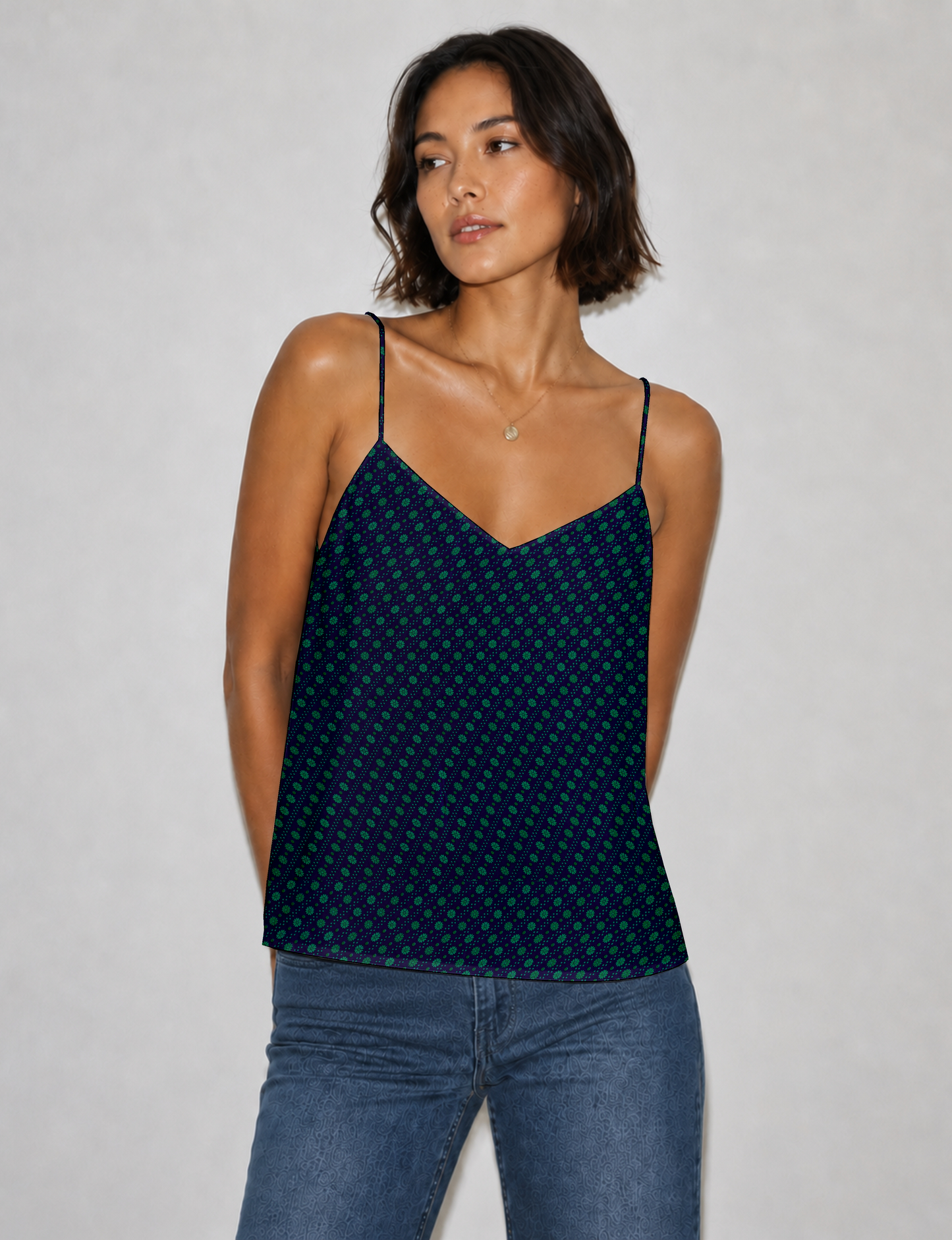 Women's sleeveless slip top with a relaxed straight fit, soft V-neckline, deep V-back, and delicate spaghetti straps.