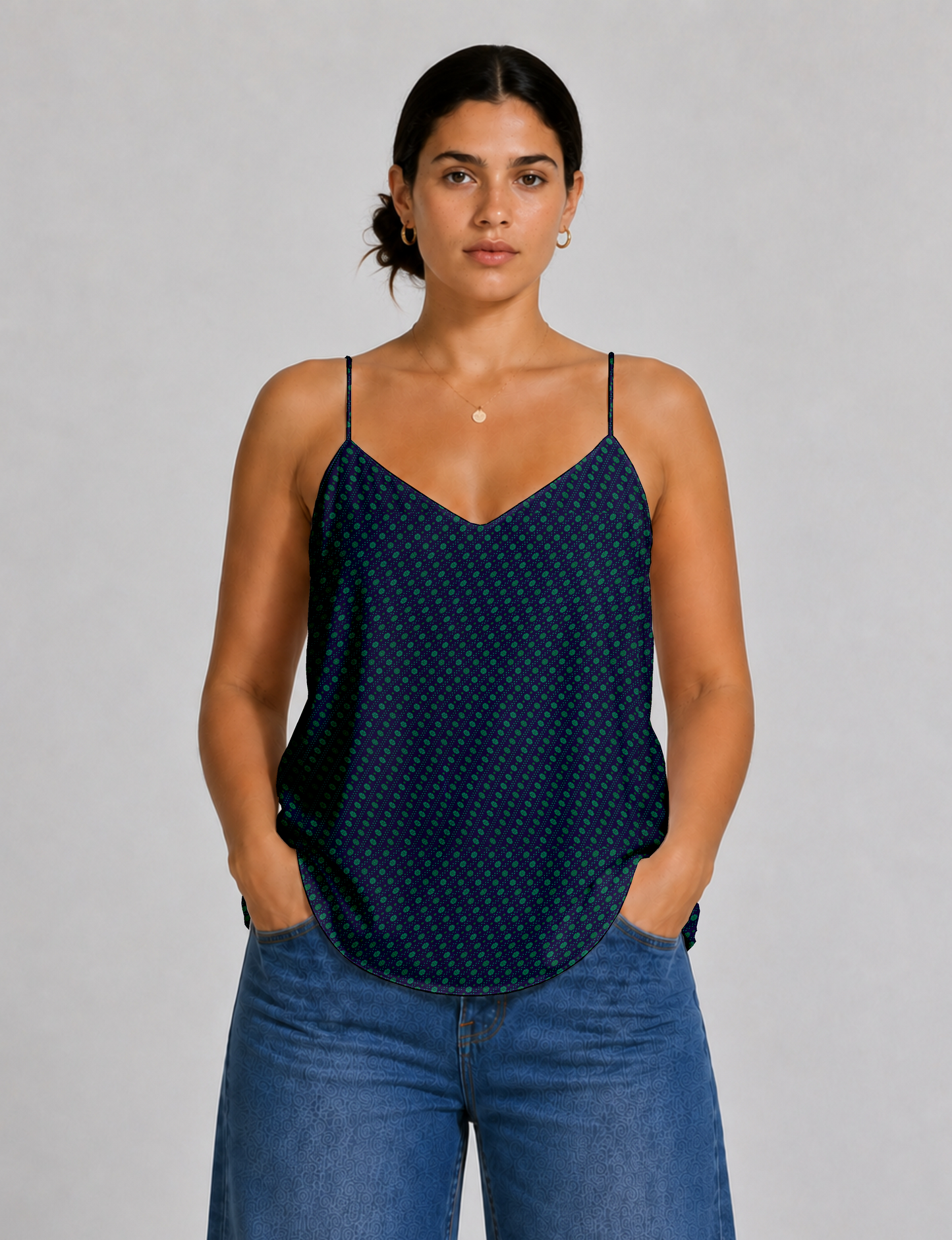 Women's sleeveless slip top with a relaxed straight fit, soft V-neckline, deep V-back, and delicate spaghetti straps.