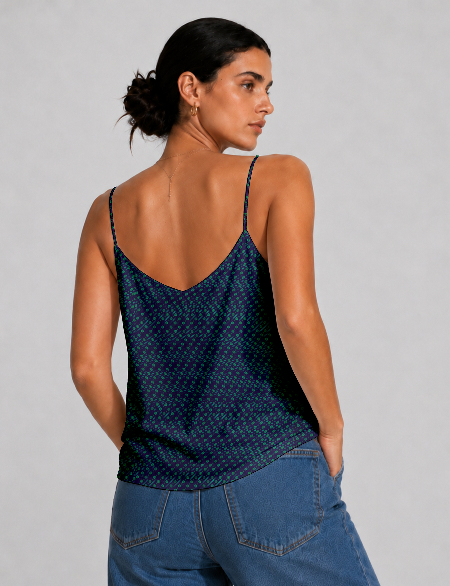 Women's sleeveless slip top with a relaxed straight fit, soft V-neckline, deep V-back, and delicate spaghetti straps.