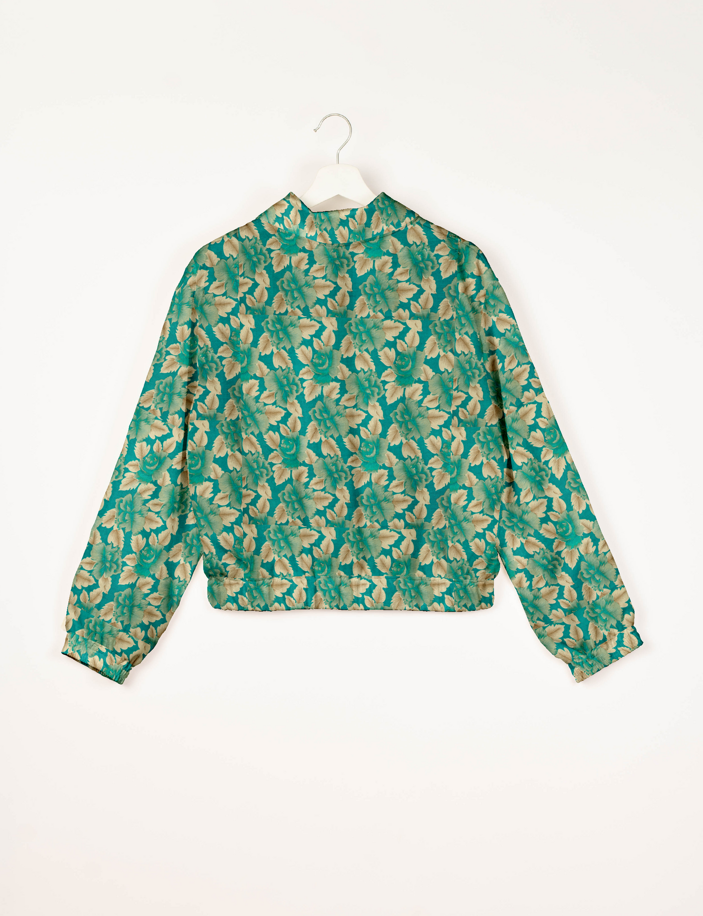 Upcycled Bomber Jacket made from recycled sari materials, featuring a cute cropped shape, elasticated hem and cuffs, and contrast sari print lining. Sustainable apparel promoting eco-friendly fashion and ethical clothing.