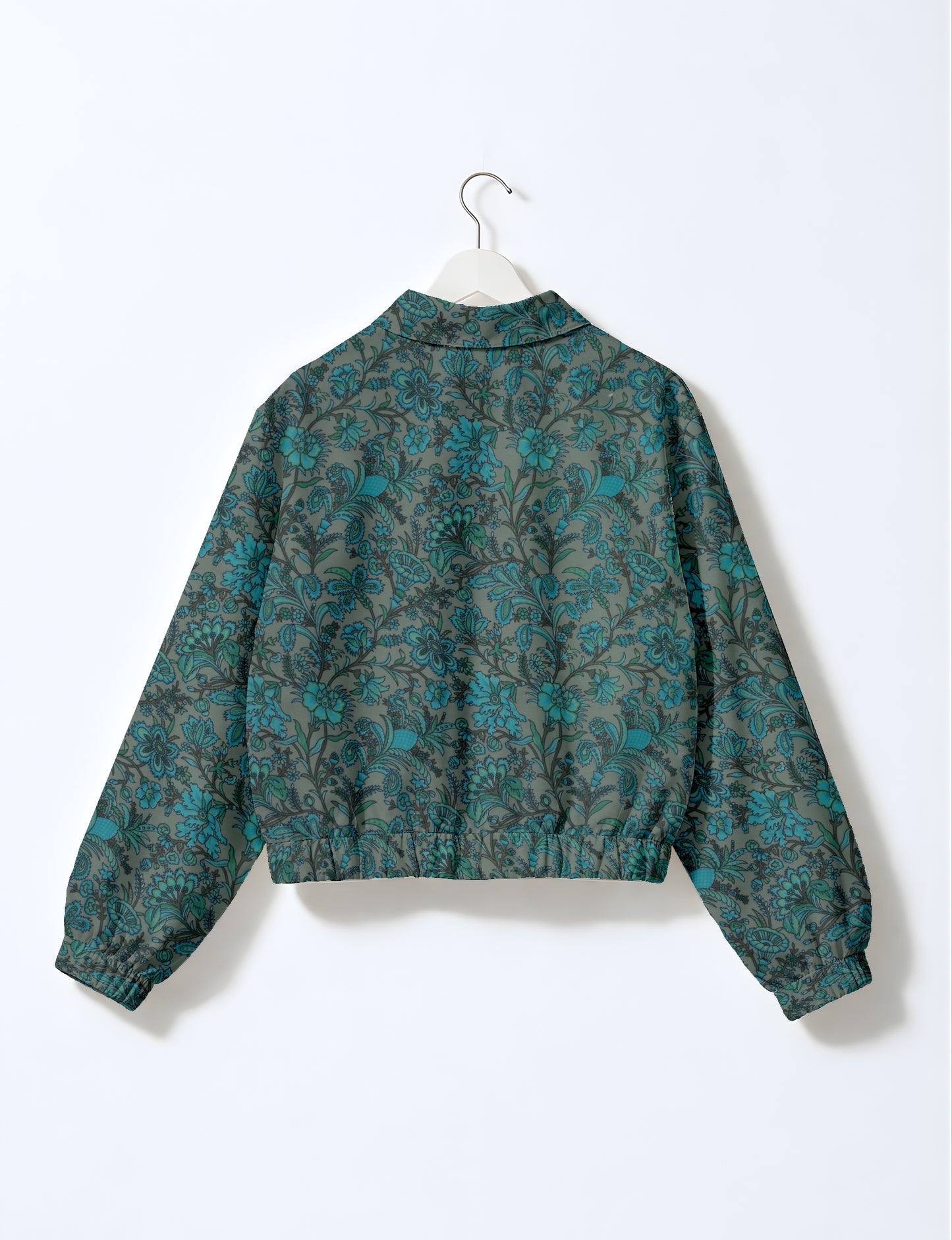 Women's cropped bomber jacket with twin metallic front zippers, welt pockets, elasticated hem and cuffs, and contrast sari print lining.