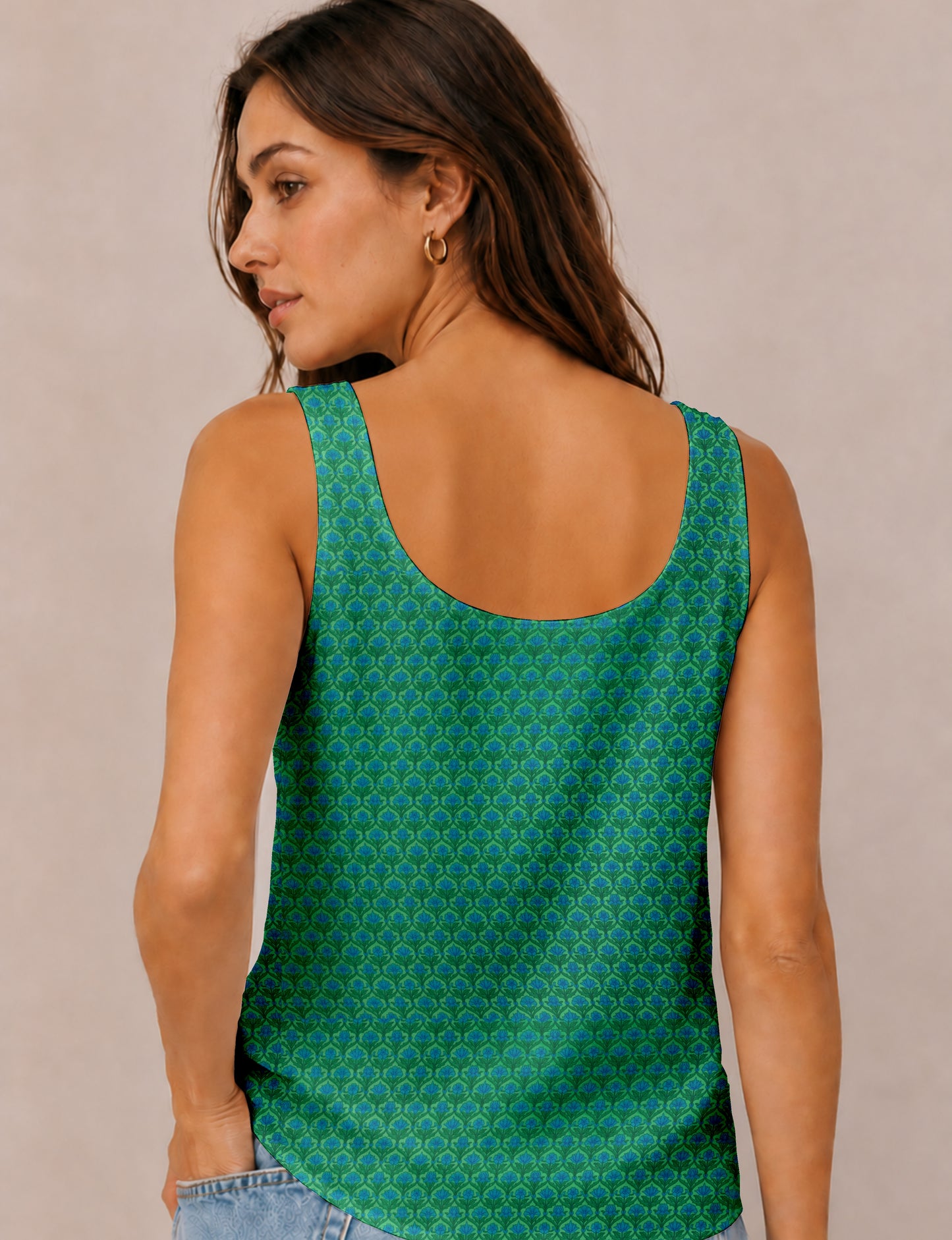 Women's sleeveless blouse with a relaxed straight fit, wide scoop neckline, deep scoop back, and hip-length silhouette.