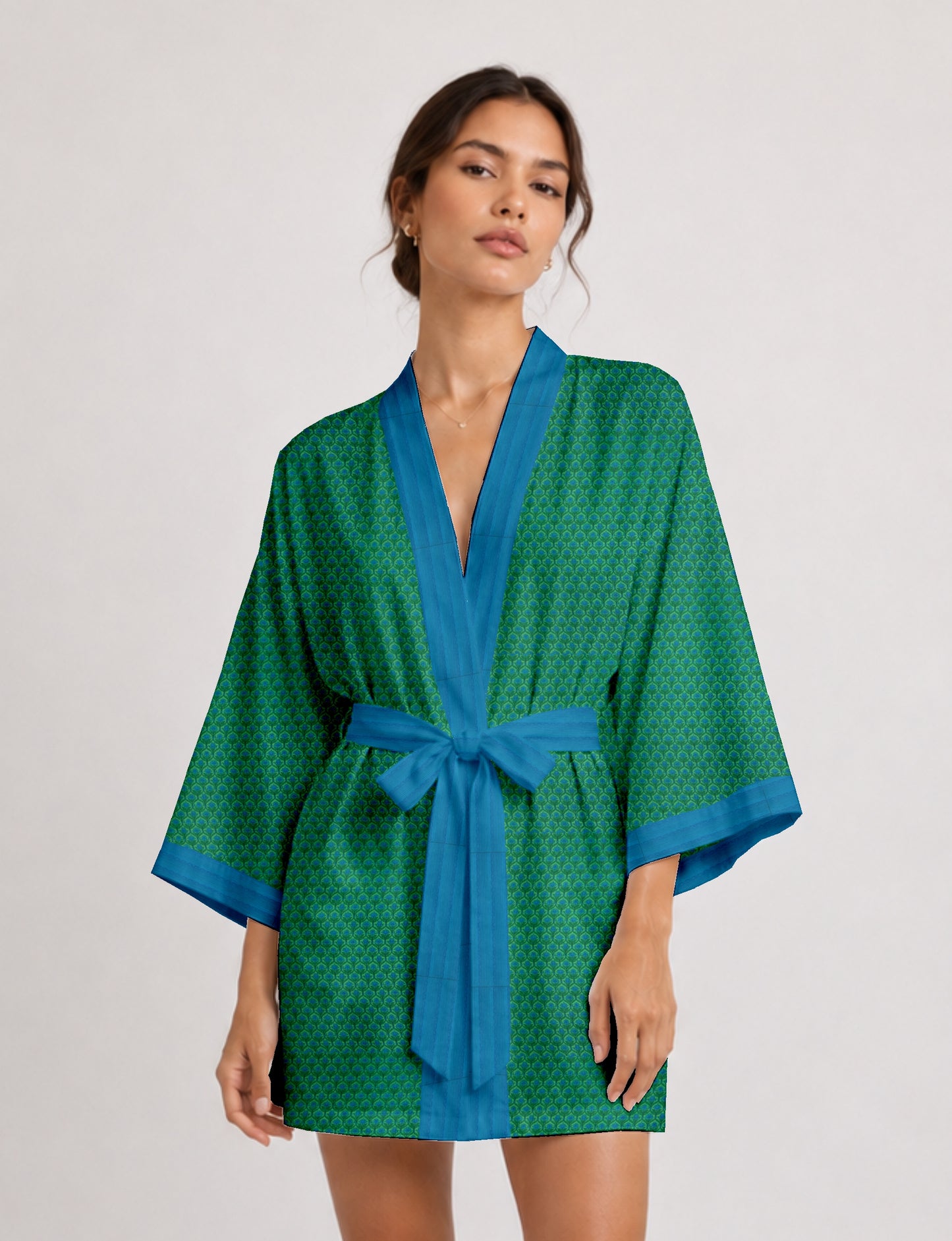 Short kimono robe with wrap front, V-neckline, wide sleeves, waist tie, and concealed skort detail.