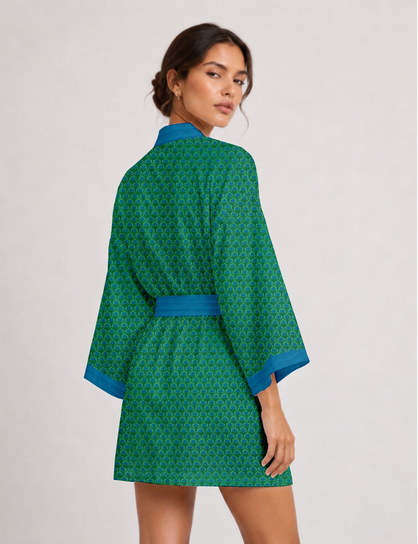 Short kimono robe with wrap front, V-neckline, wide sleeves, waist tie, and concealed skort detail.