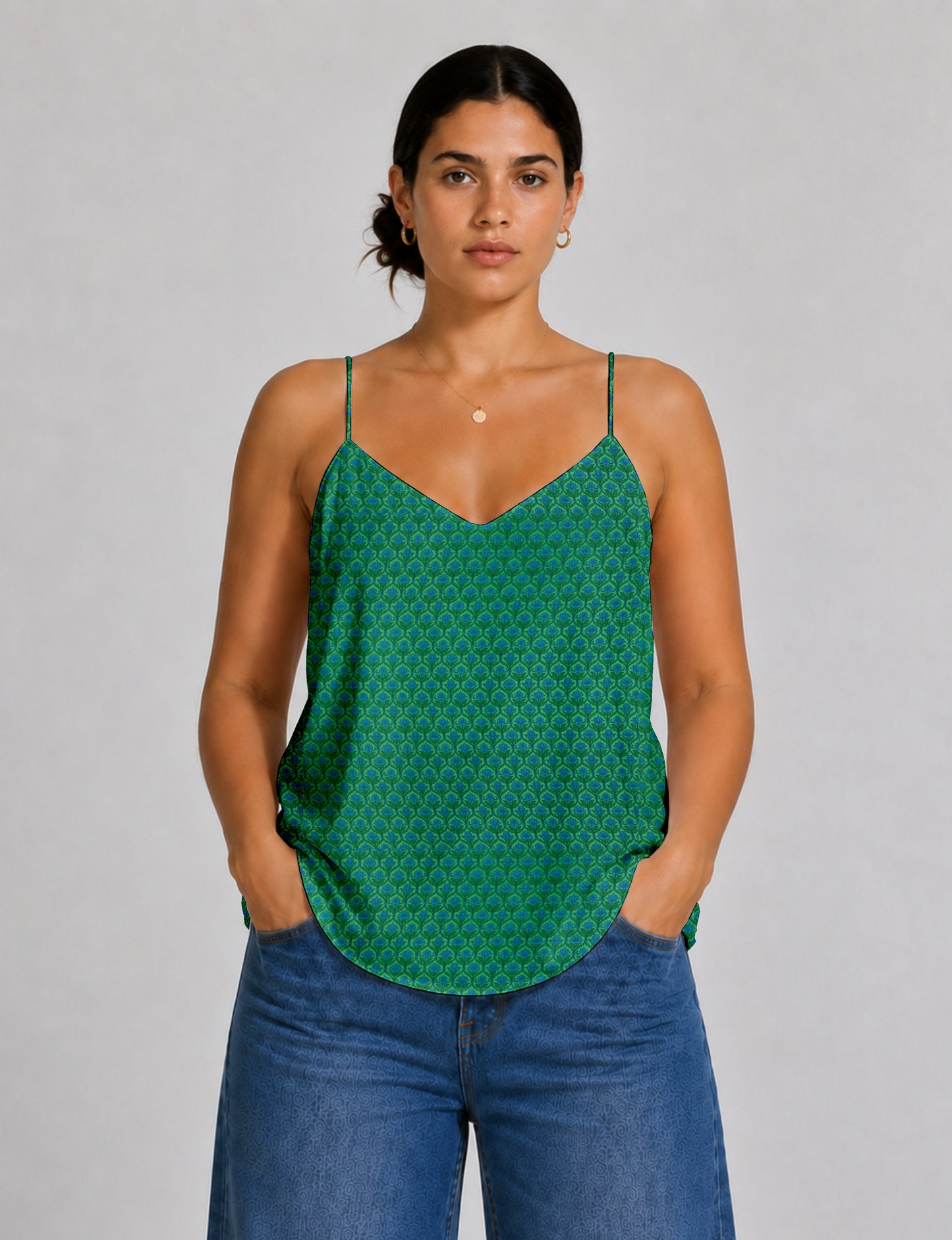 Women's sleeveless slip top with a relaxed straight fit, soft V-neckline, deep V-back, and delicate spaghetti straps.
