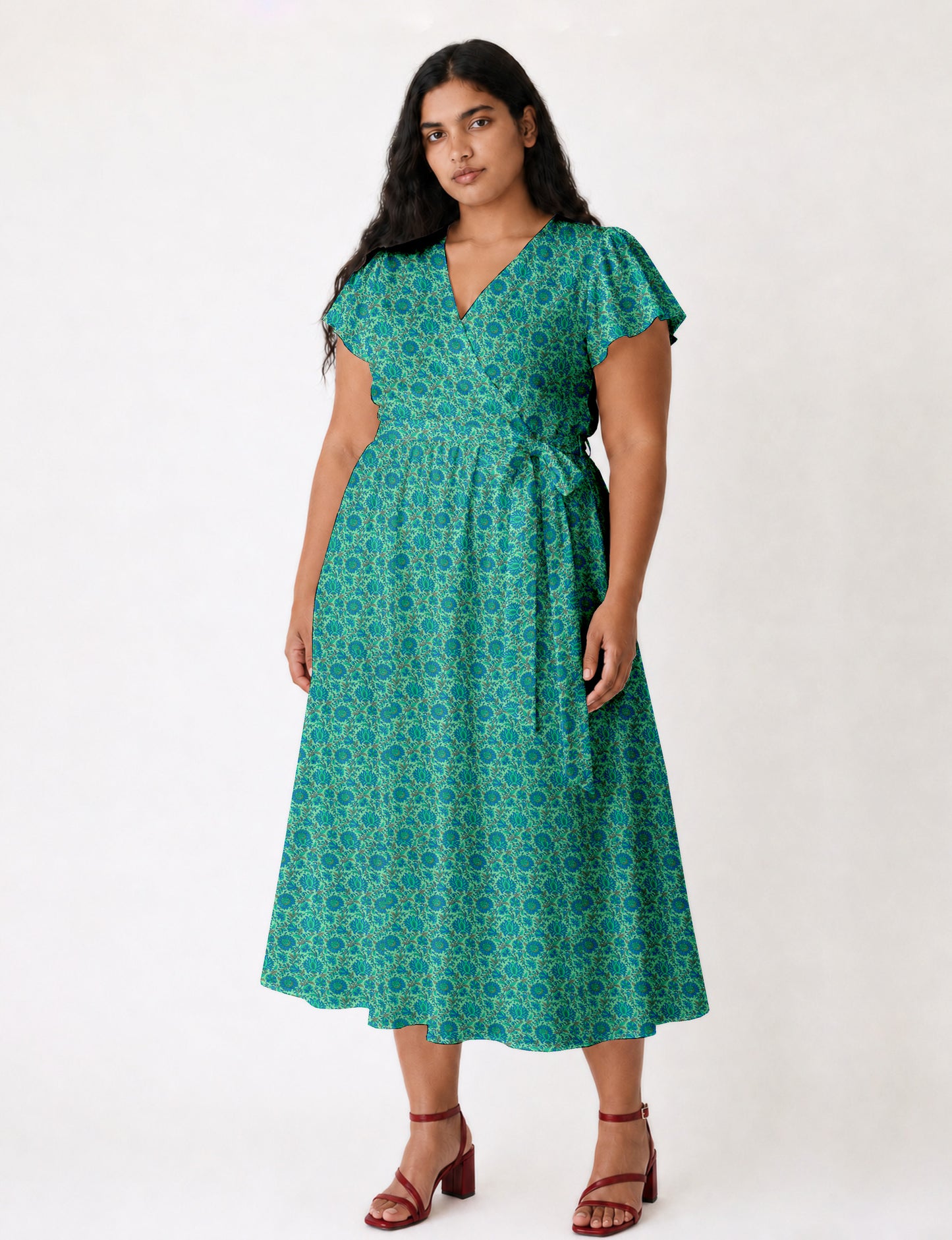 Elegant midi wrap dress with a V-neckline, adjustable waist tie, fitted bodice, and flared skirt for a timeless, flattering silhouette.
