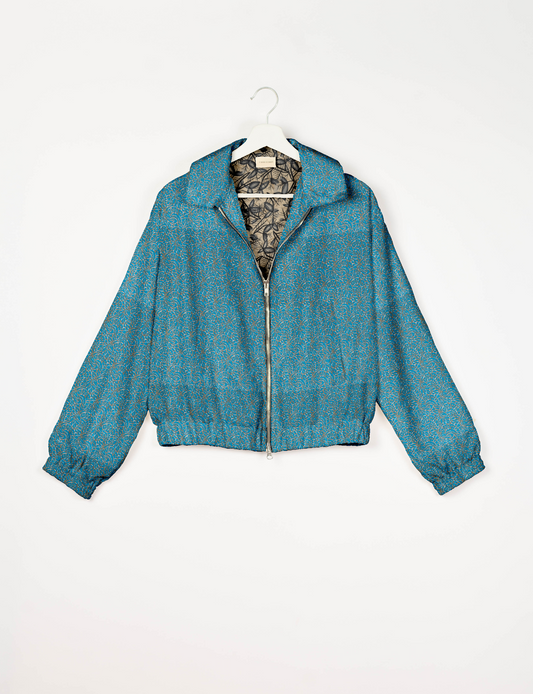 Upcycled Bomber Jacket made from recycled sari materials, featuring a cute cropped shape, elasticated hem and cuffs, and contrast sari print lining. Sustainable apparel promoting eco-friendly fashion and ethical clothing.