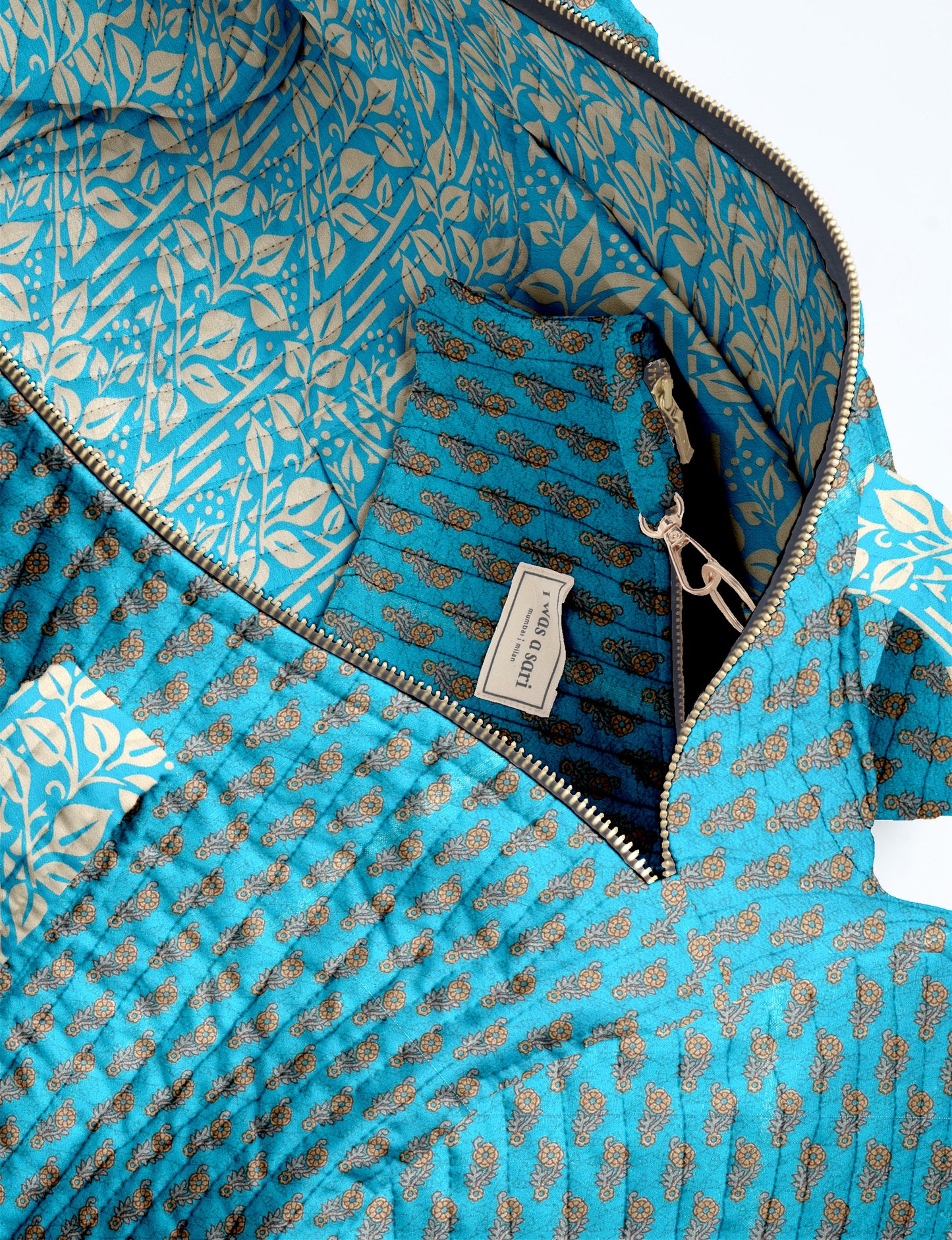 Quilted brown paisley bowling bag with gold zipper, floral interior lining, and interior key clip with label inside pocket
