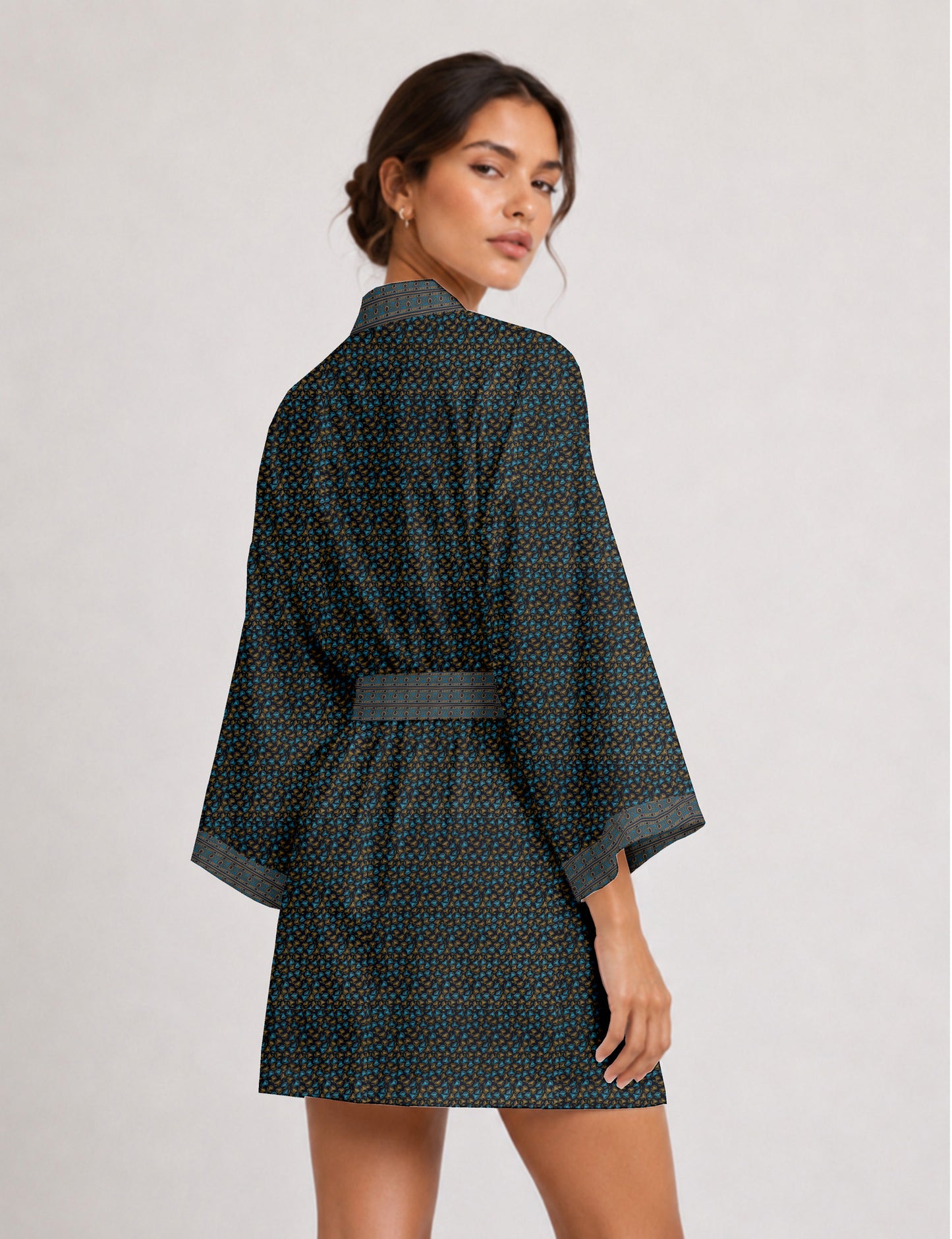 Short kimono robe with wrap front, V-neckline, wide sleeves, waist tie, and concealed skort detail.