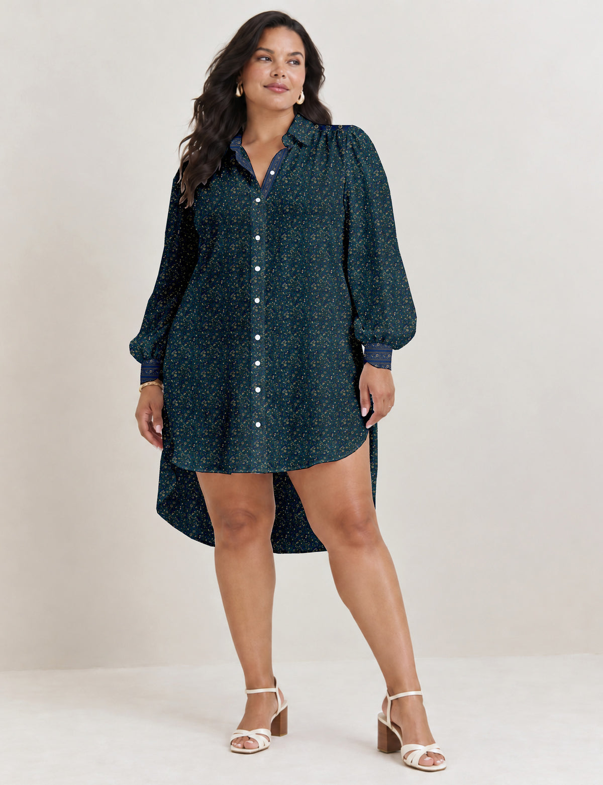 High low shirt with a relaxed fit, button-down front, classic collar, gathered shoulders and full-length blouson sleeves.