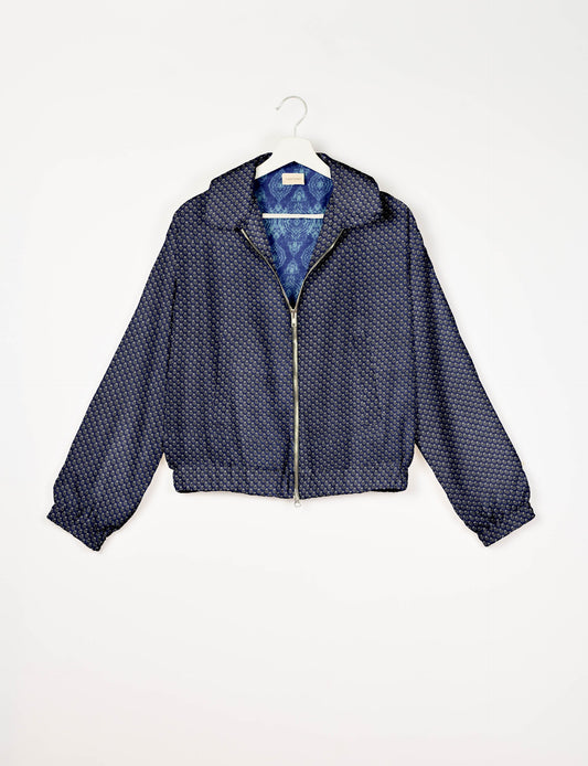 Upcycled Bomber Jacket made from recycled sari materials, featuring a cute cropped shape, elasticated hem and cuffs, and contrast sari print lining. Sustainable apparel promoting eco-friendly fashion and ethical clothing.
