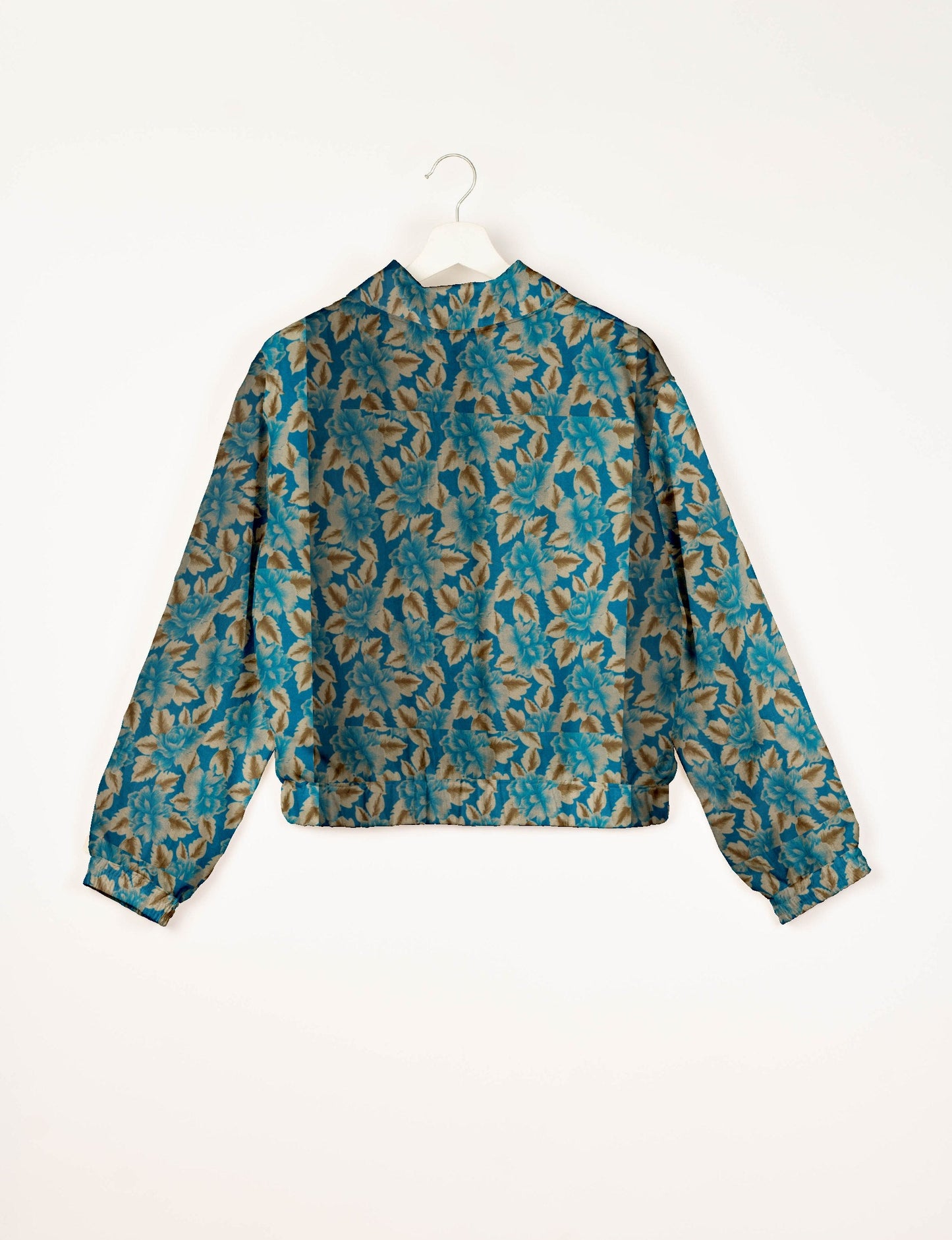 Upcycled Bomber Jacket made from recycled sari materials, featuring a cute cropped shape, elasticated hem and cuffs, and contrast sari print lining. Sustainable apparel promoting eco-friendly fashion and ethical clothing.