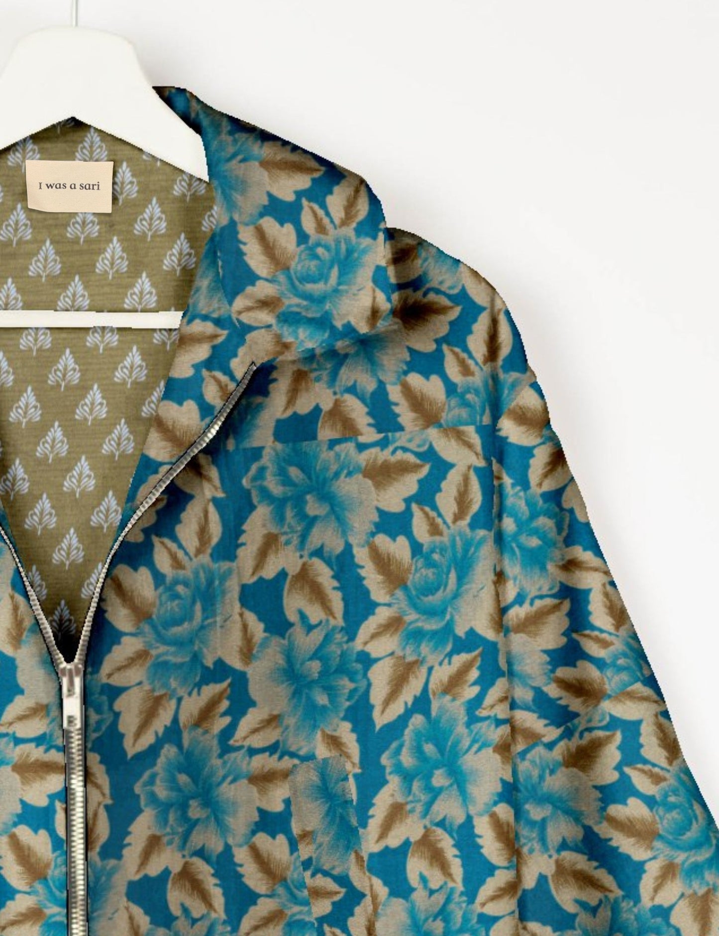 Upcycled Bomber Jacket made from recycled sari materials, featuring a cute cropped shape, elasticated hem and cuffs, and contrast sari print lining. Sustainable apparel promoting eco-friendly fashion and ethical clothing.