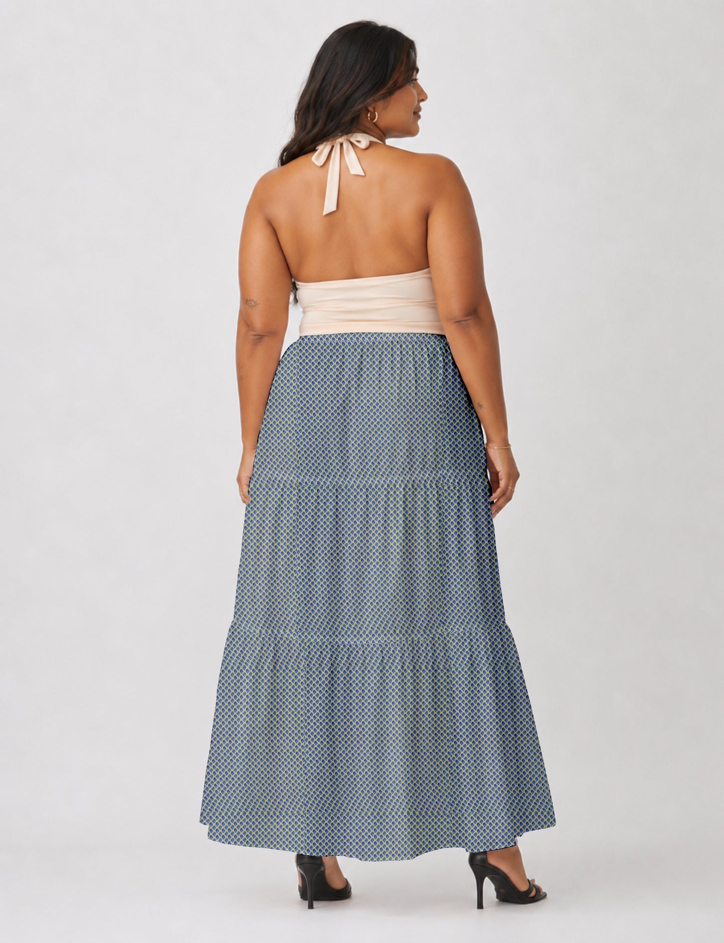 Yellow midi tiered skirt with small dark geometric micro pattern, flat lay front view