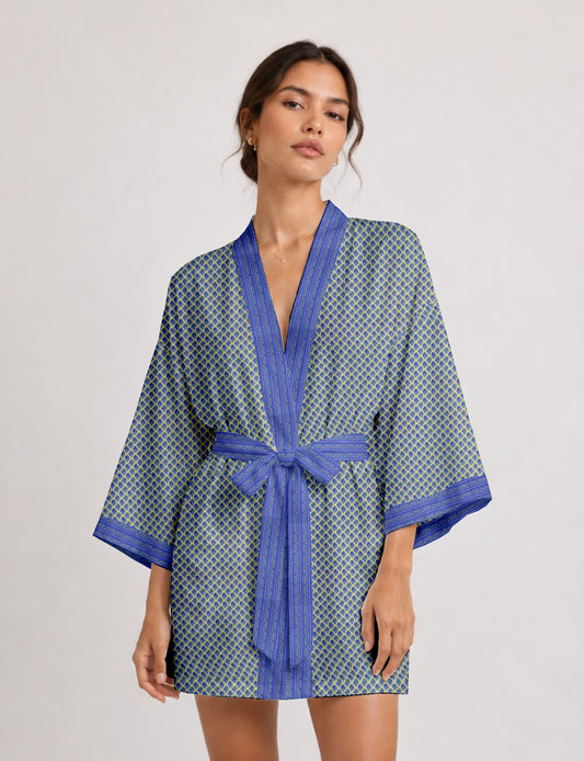Short kimono robe with wrap front, V-neckline, wide sleeves, waist tie, and concealed skort detail.