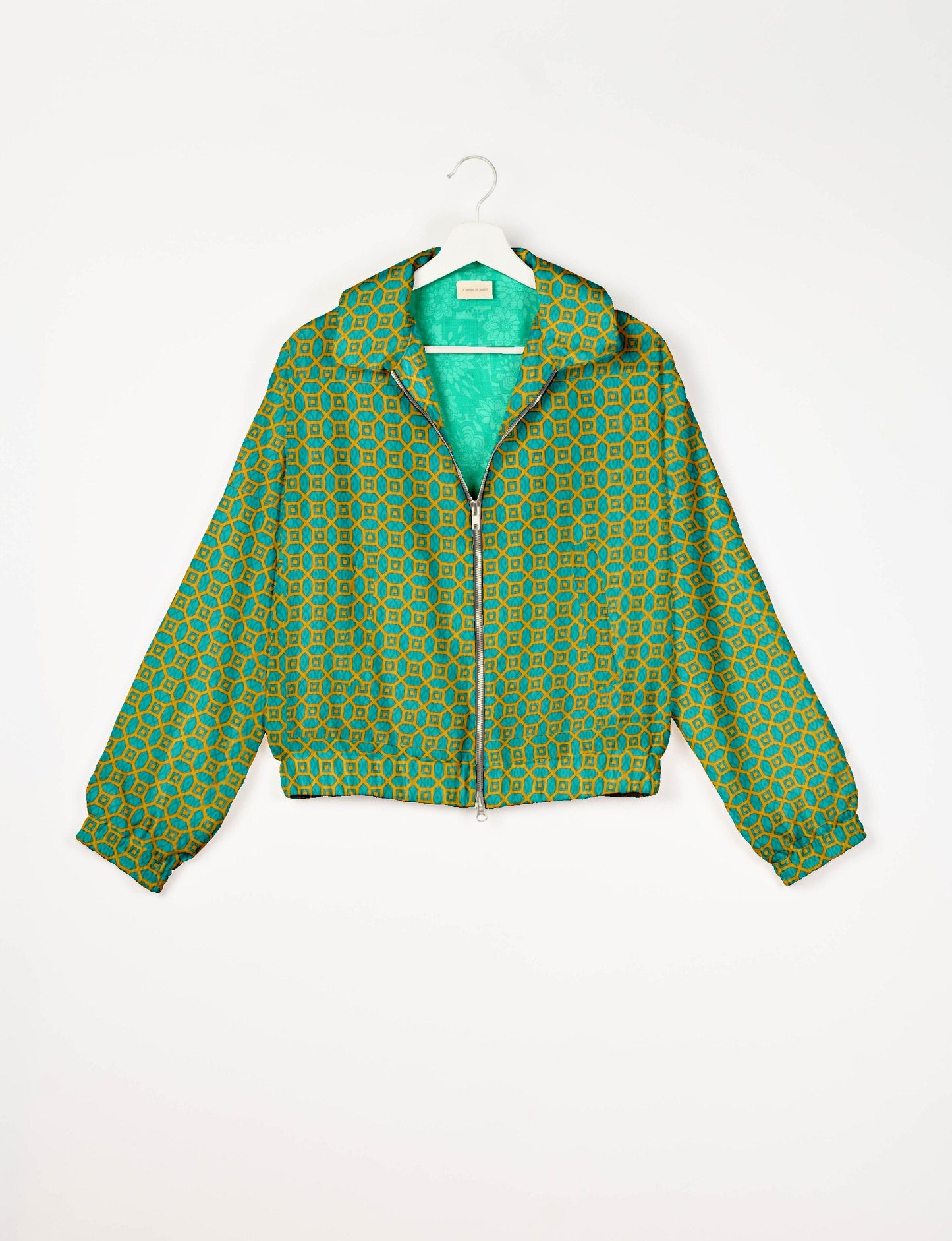 Upcycled Bomber Jacket made from recycled sari materials, featuring a cute cropped shape, elasticated hem and cuffs, and contrast sari print lining. Sustainable apparel promoting eco-friendly fashion and ethical clothing.