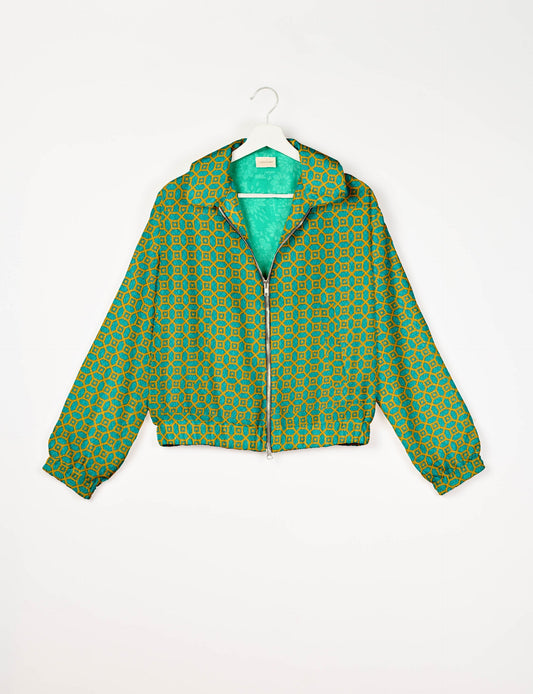 Upcycled Bomber Jacket made from recycled sari materials, featuring a cute cropped shape, elasticated hem and cuffs, and contrast sari print lining. Sustainable apparel promoting eco-friendly fashion and ethical clothing.