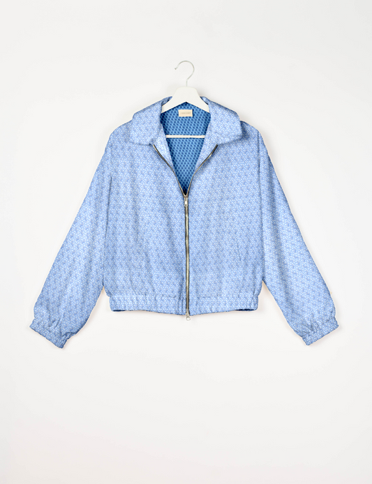 Upcycled Bomber Jacket made from recycled sari materials, featuring a cute cropped shape, elasticated hem and cuffs, and contrast sari print lining. Sustainable apparel promoting eco-friendly fashion and ethical clothing.