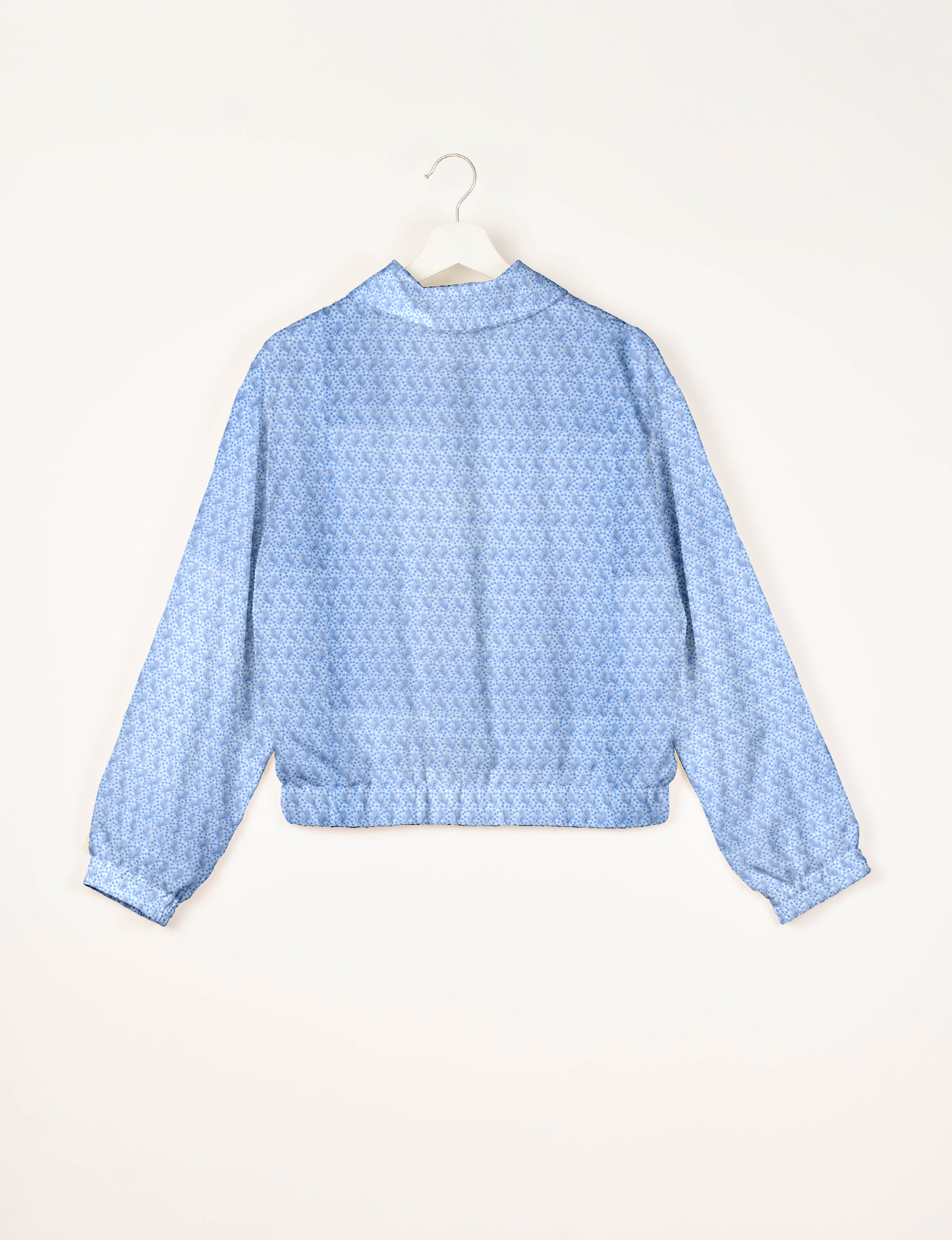 Upcycled Bomber Jacket made from recycled sari materials, featuring a cute cropped shape, elasticated hem and cuffs, and contrast sari print lining. Sustainable apparel promoting eco-friendly fashion and ethical clothing.