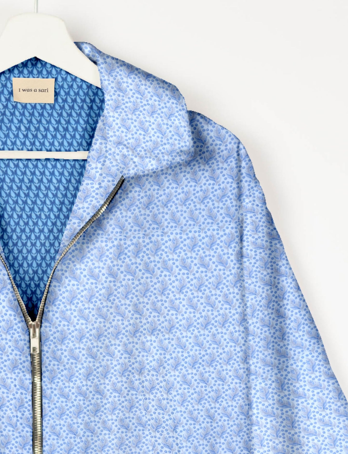 Upcycled Bomber Jacket made from recycled sari materials, featuring a cute cropped shape, elasticated hem and cuffs, and contrast sari print lining. Sustainable apparel promoting eco-friendly fashion and ethical clothing.