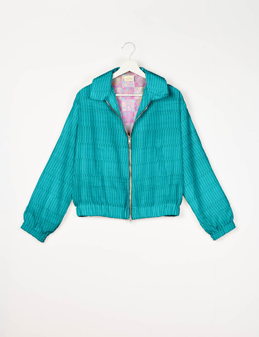 Upcycled Bomber Jacket made from recycled sari materials, featuring a cute cropped shape, elasticated hem and cuffs, and contrast sari print lining. Sustainable apparel promoting eco-friendly fashion and ethical clothing.