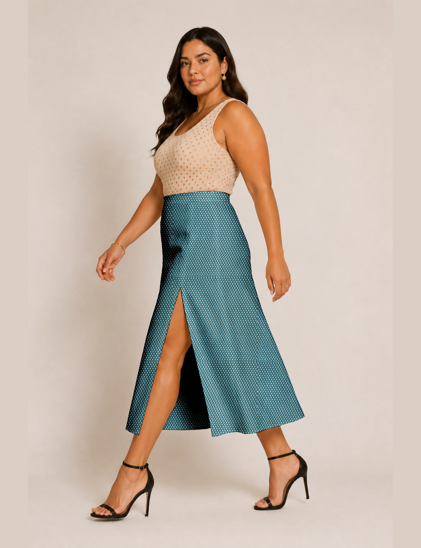 Woman wearing a yellow and black micro patterned A-line skirt with front slit, paired with beige sleeveless top and black