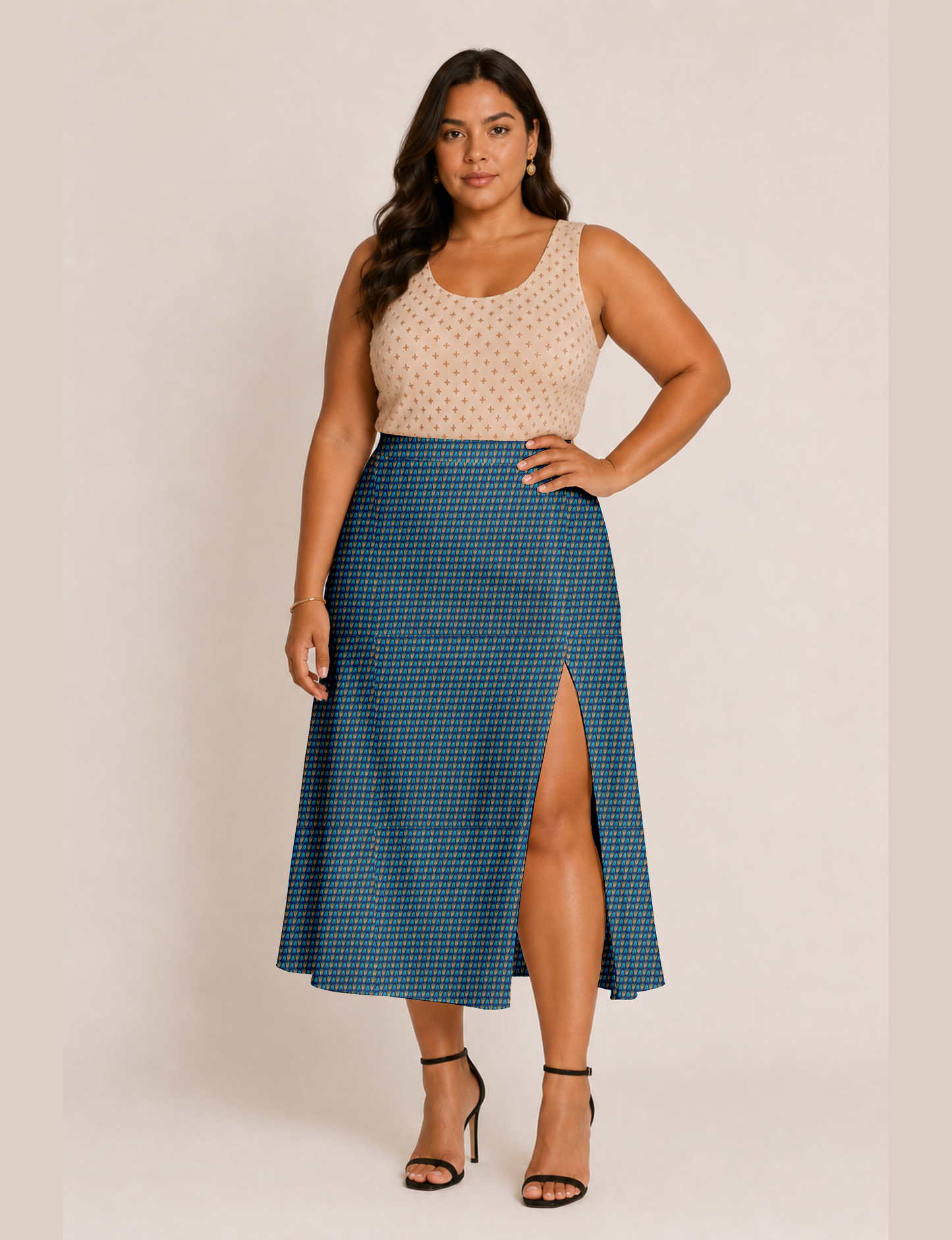 Woman wearing a yellow and black micro patterned A-line skirt with front slit, paired with beige sleeveless top and black