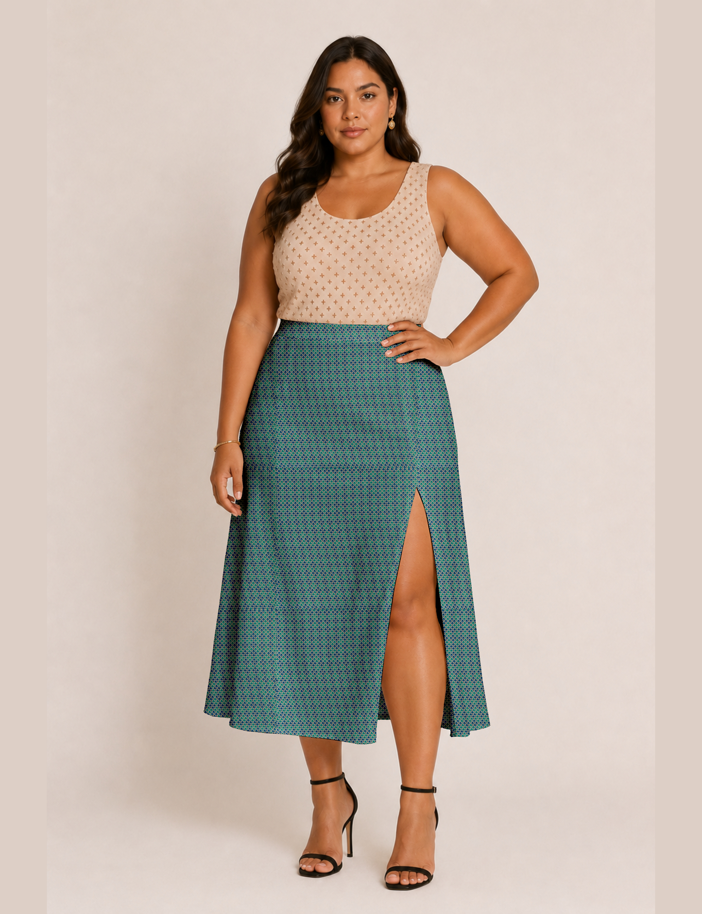Woman wearing a yellow and black micro patterned A-line skirt with front slit, paired with beige sleeveless top and black
