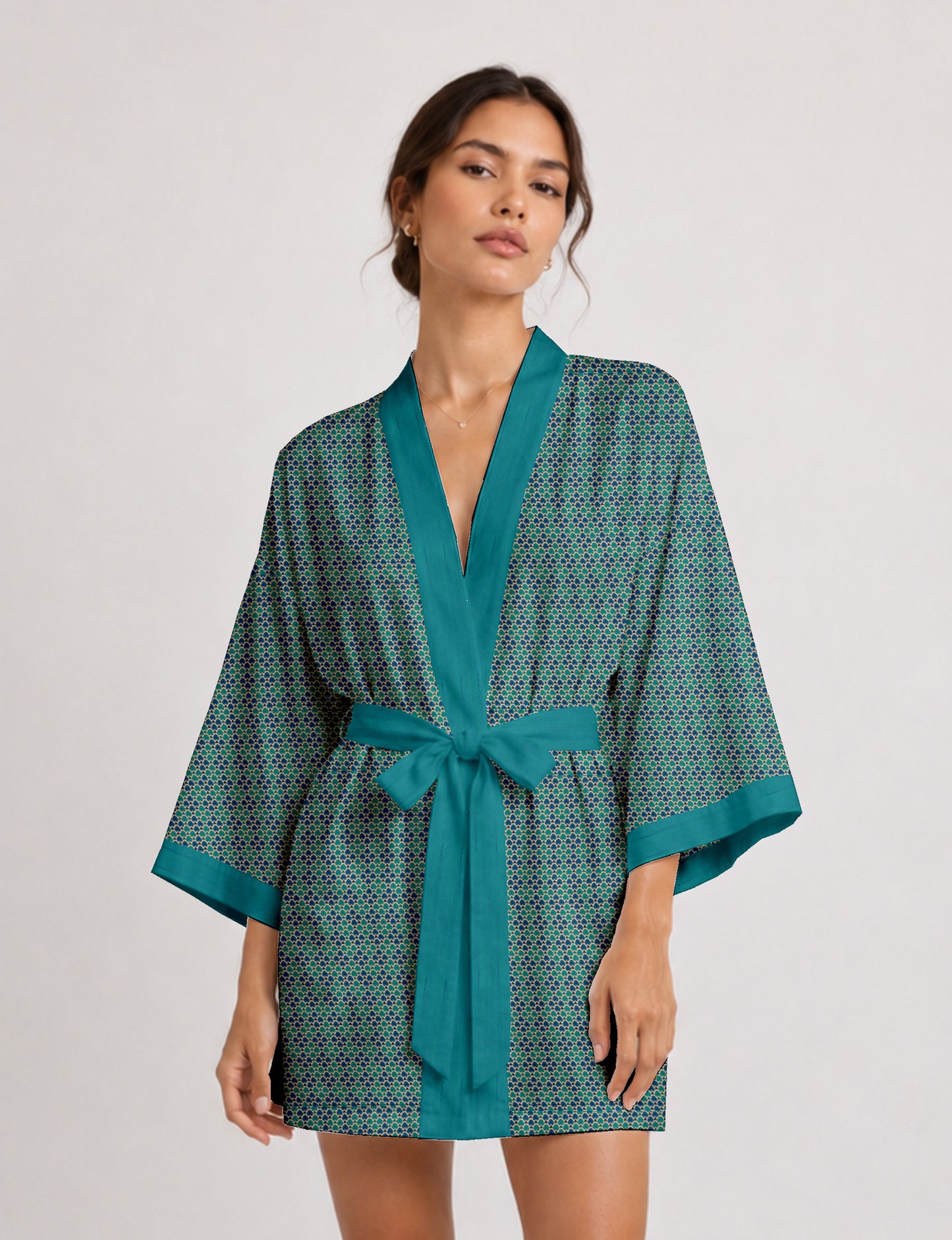 Short kimono robe with wrap front, V-neckline, wide sleeves, waist tie, and concealed skort detail.