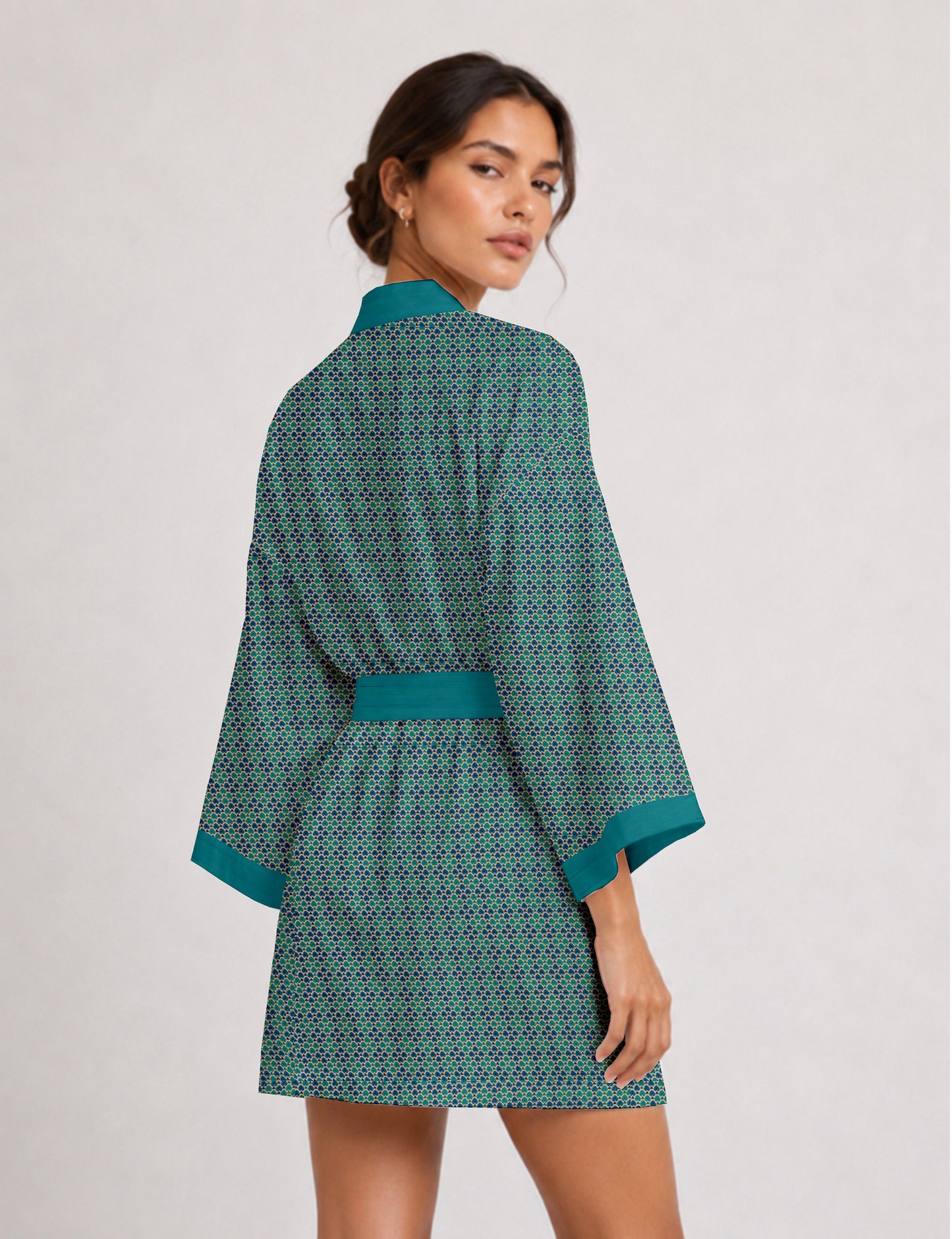 Short kimono robe with wrap front, V-neckline, wide sleeves, waist tie, and concealed skort detail.