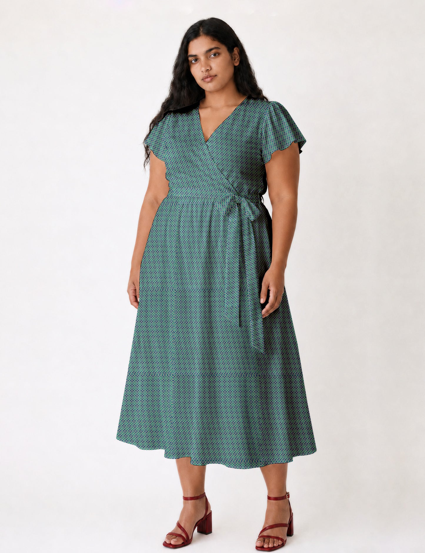 Elegant midi wrap dress with a V-neckline, adjustable waist tie, fitted bodice, and flared skirt for a timeless, flattering silhouette.