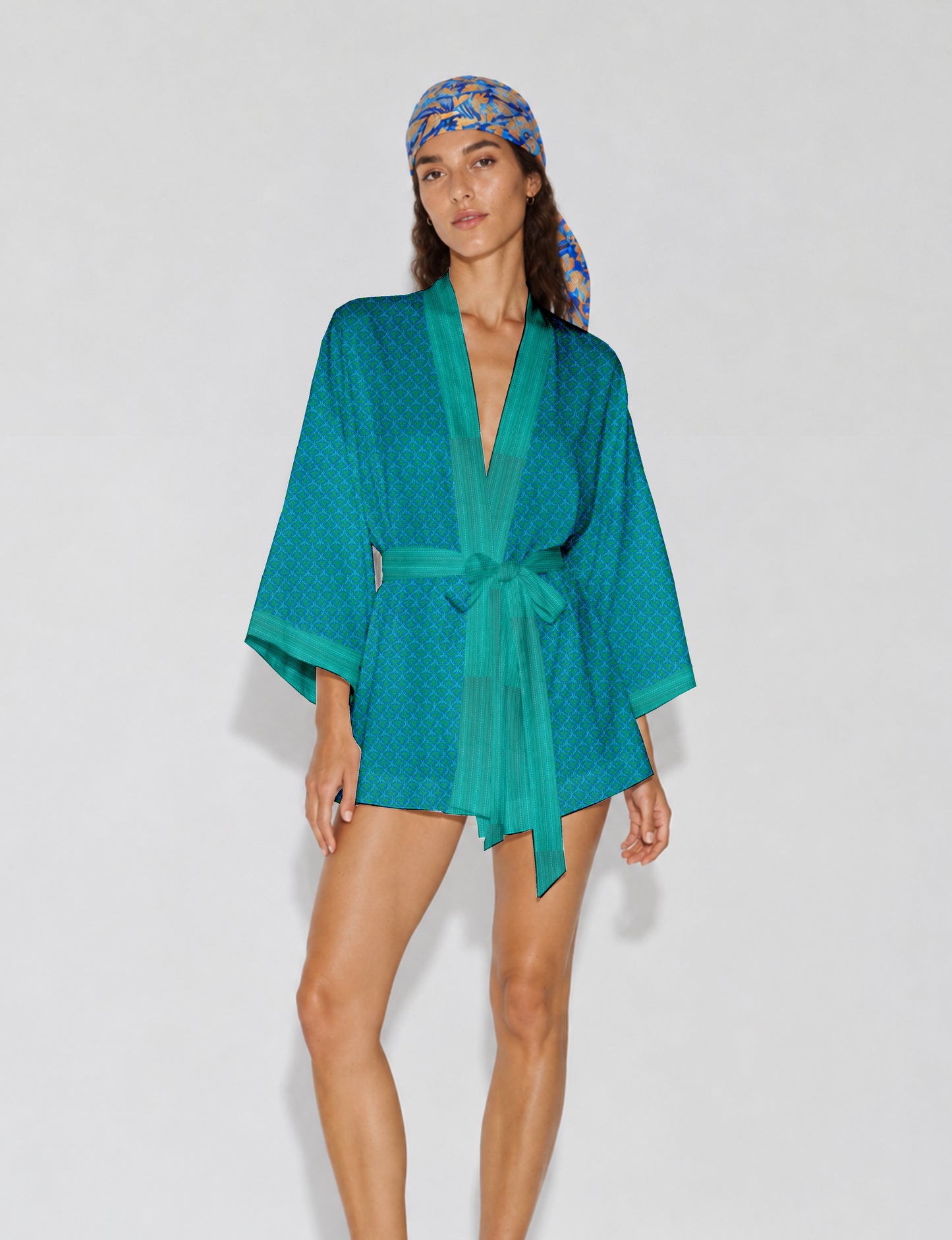 Short kimono robe with wrap front, V-neckline, wide sleeves, waist tie, and concealed skort detail.