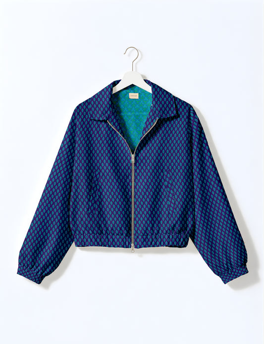 Blue bomber jacket with teal micro leaf pattern, front zipper, elastic cuffs and hem, shown on white hanger front view
