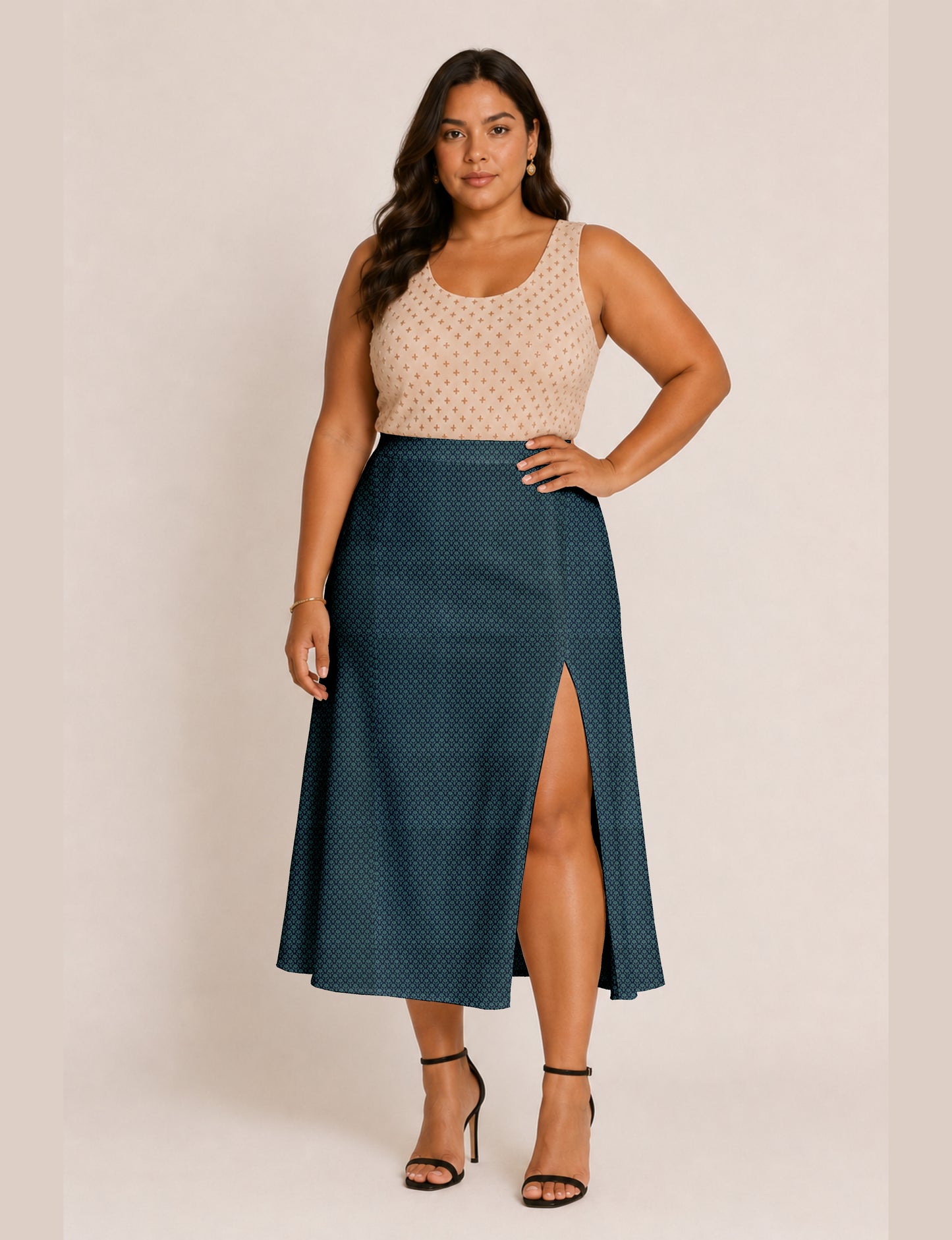 Woman wearing a yellow and black micro patterned A-line skirt with front slit, paired with beige sleeveless top and black